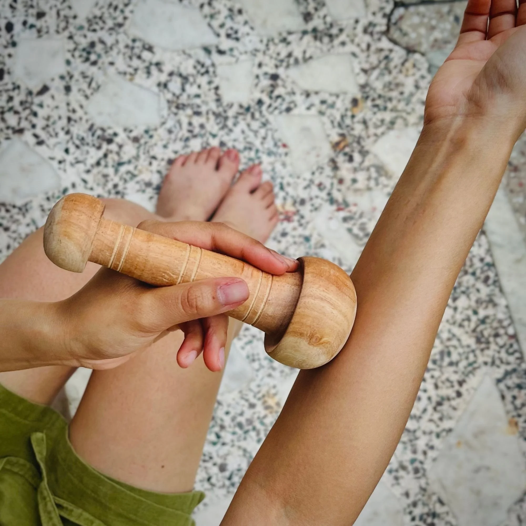 Wooden_arbor_massage_wand_forearm.jpg