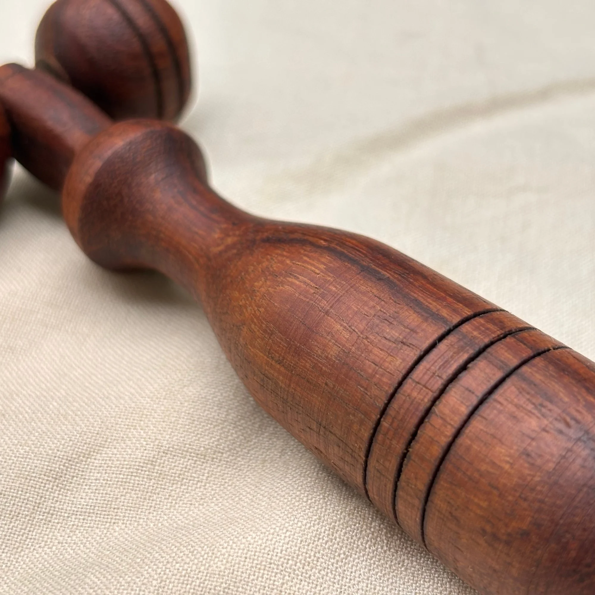 Wooden_facial_massage_roller_closeup_handle.jpg
