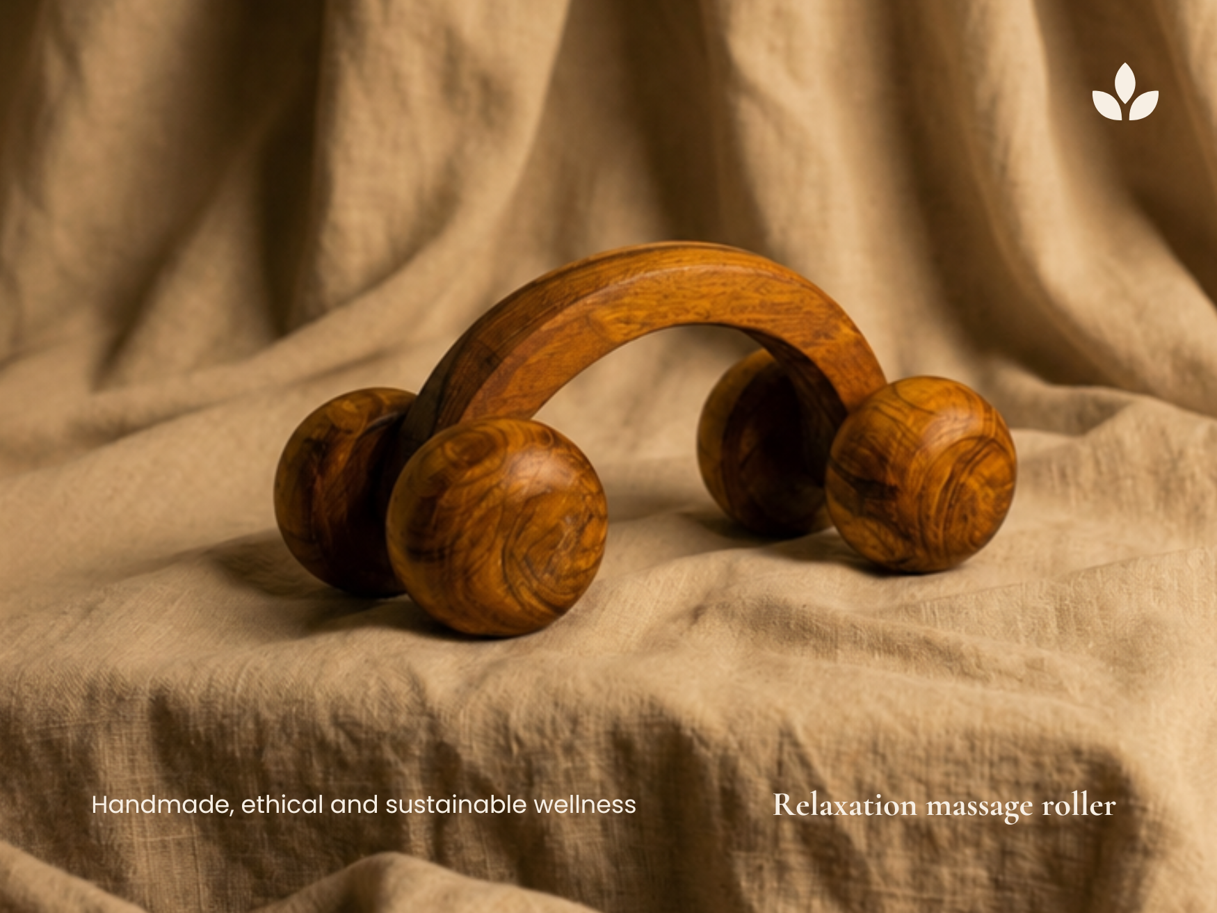 Handmade wooden relaxation massage roller with four smooth wooden massage balls on natural fabric