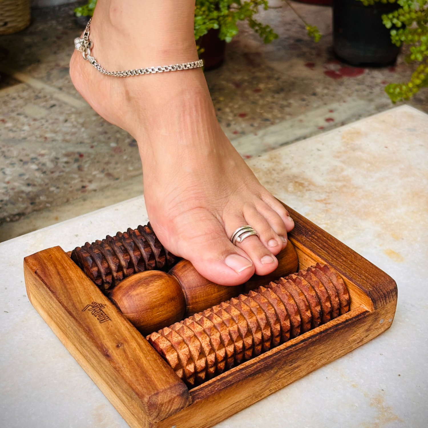 wooden-foot-reflexology-roller-in-use.png.png