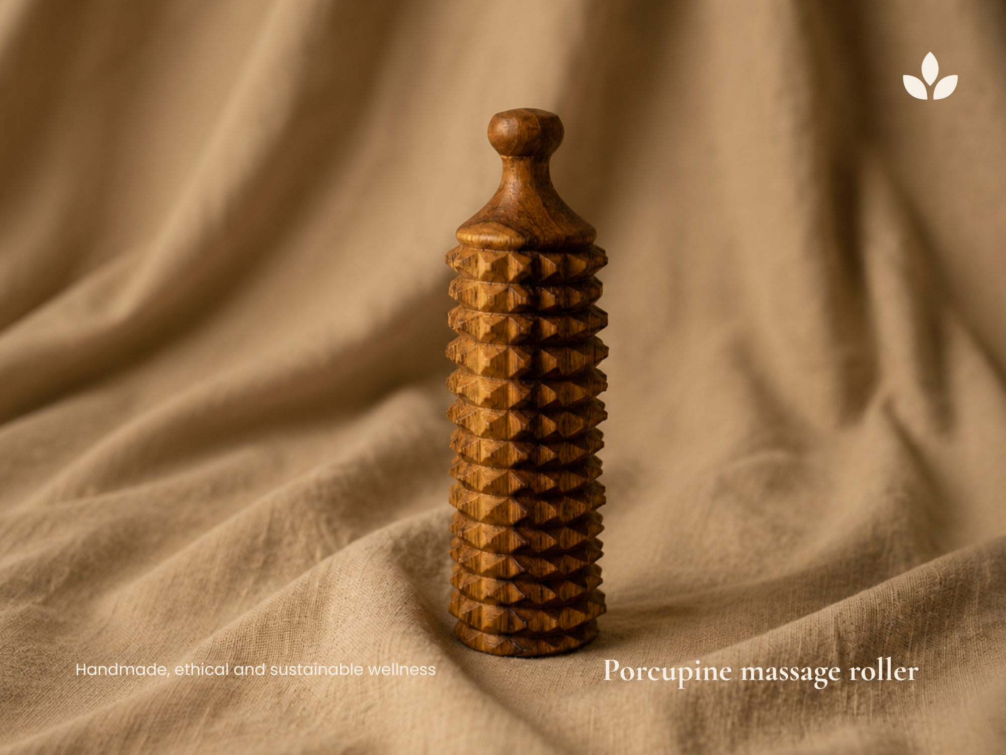 Handmade wooden porcupine massage roller on linen fabric for natural face, neck and body relaxation.