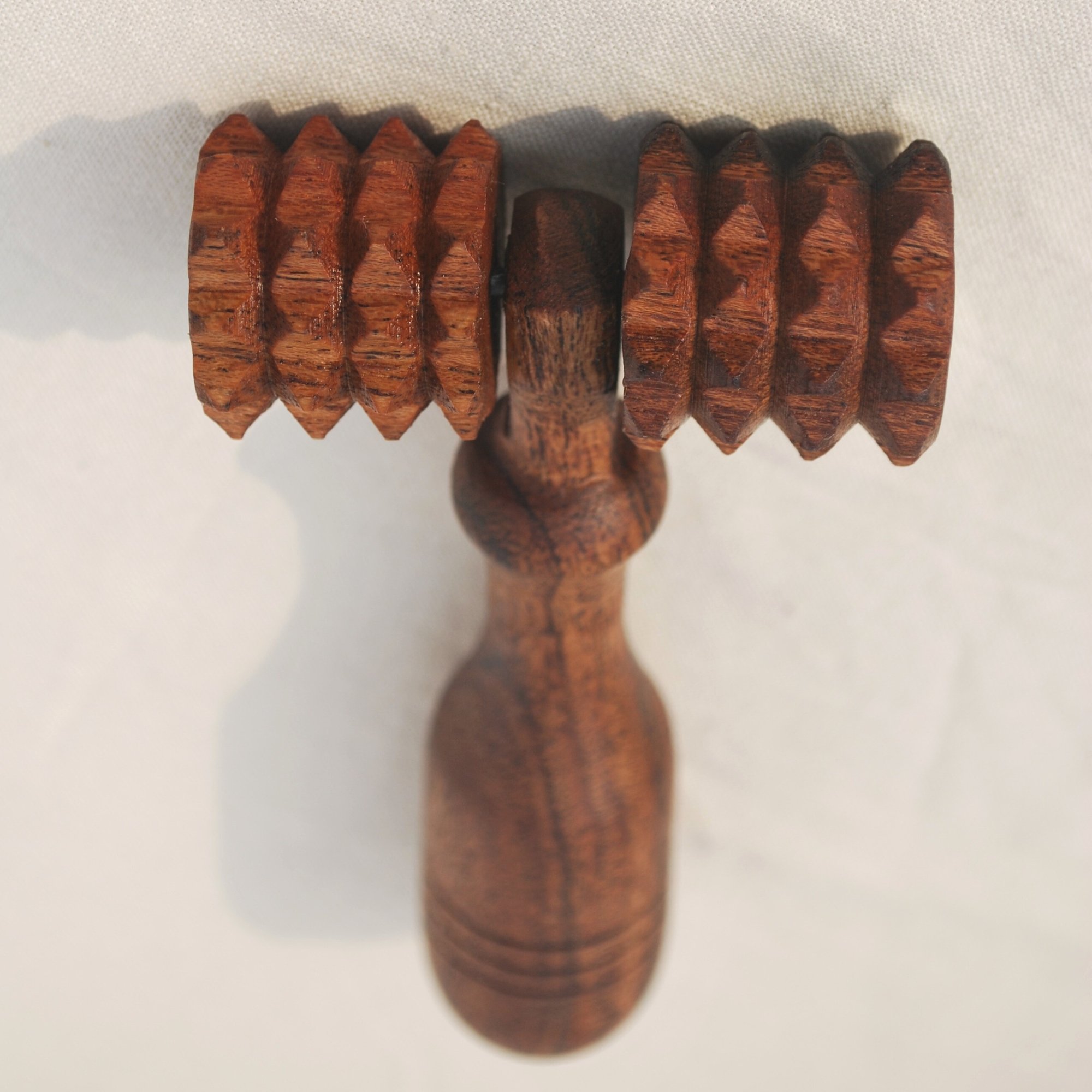 Wooden_deep_tissue_massage_roller_front_closeup.jpg