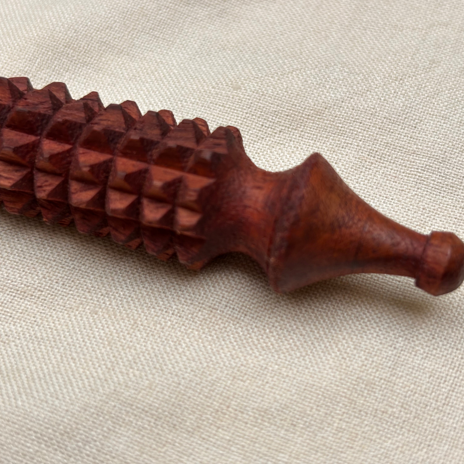 wooden-facial-acupressure-tool-handle-closeup.jpg.png