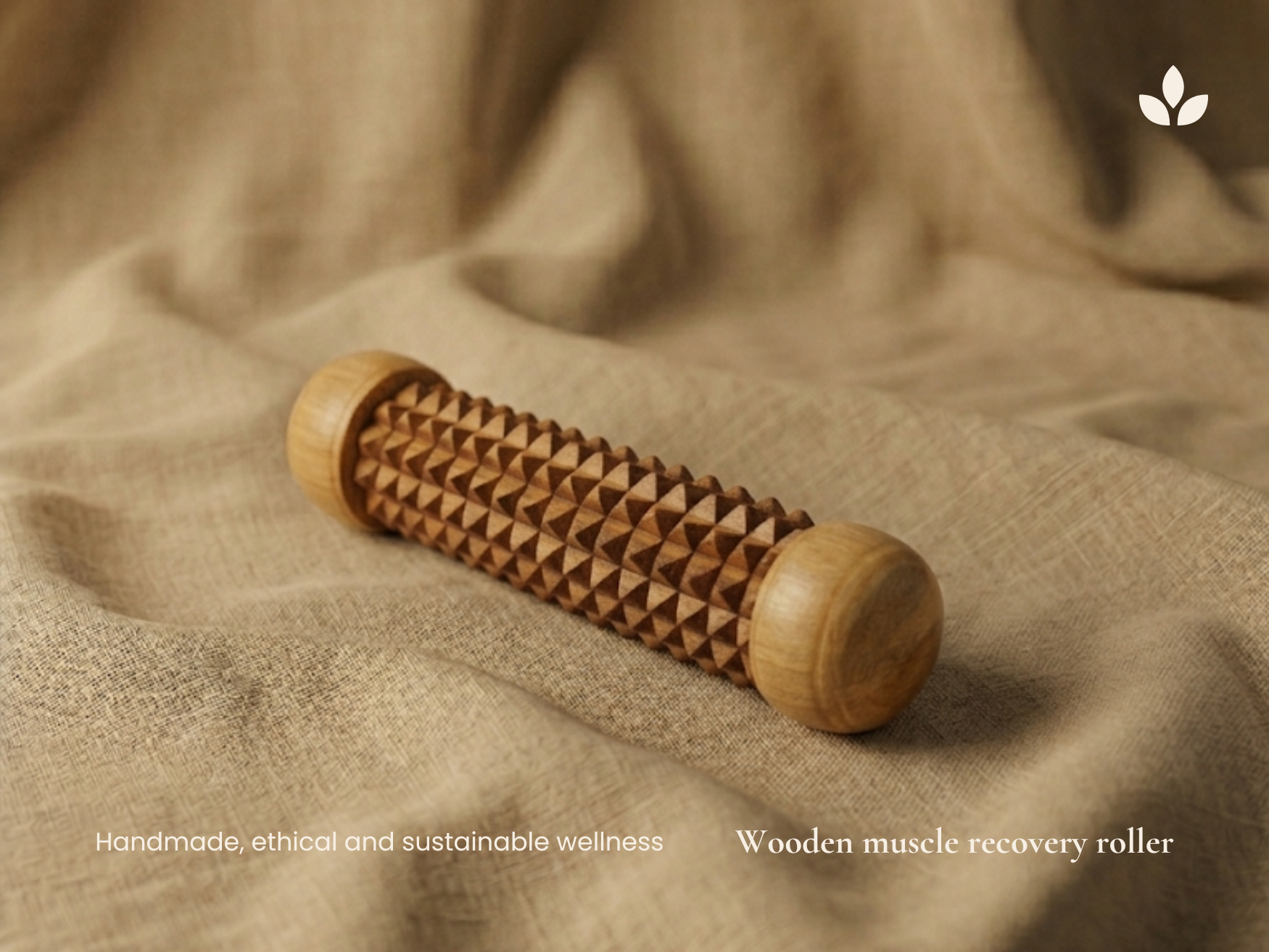 Handmade wooden muscle recovery roller on natural fabric background