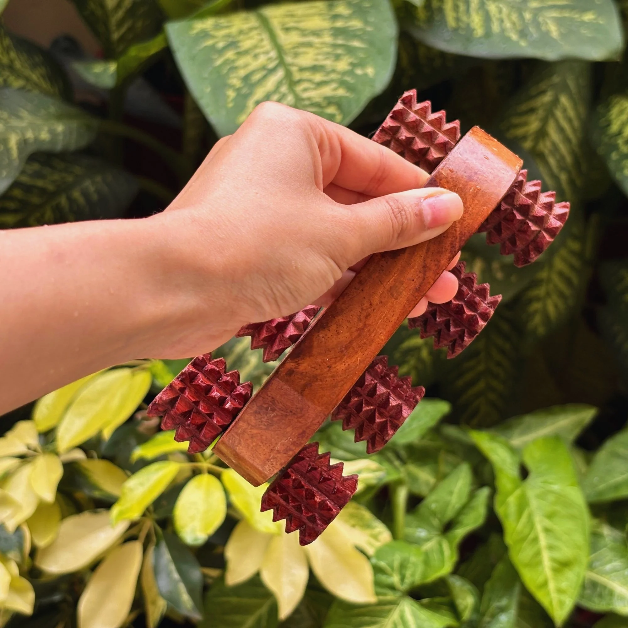 Handheld_wooden_deep_tissue_massager_lifestyle_image.jpg