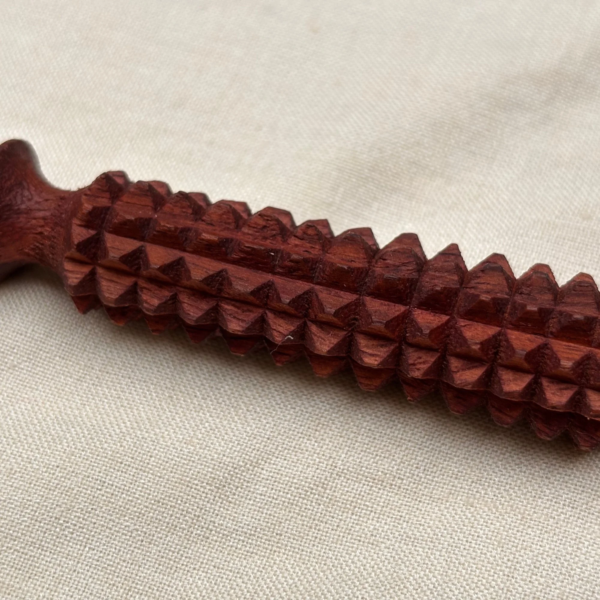 wooden_facial_acupressure_tool_closeup.jpg