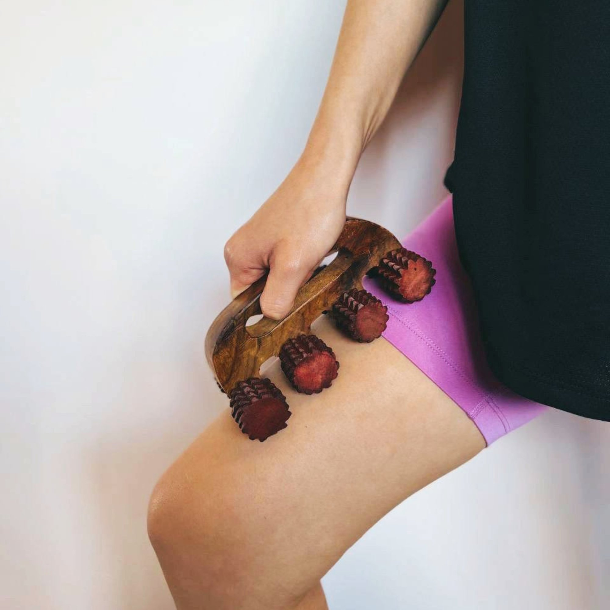 Handheld_wooden_deep_tissue_massager_thighs.jpg
