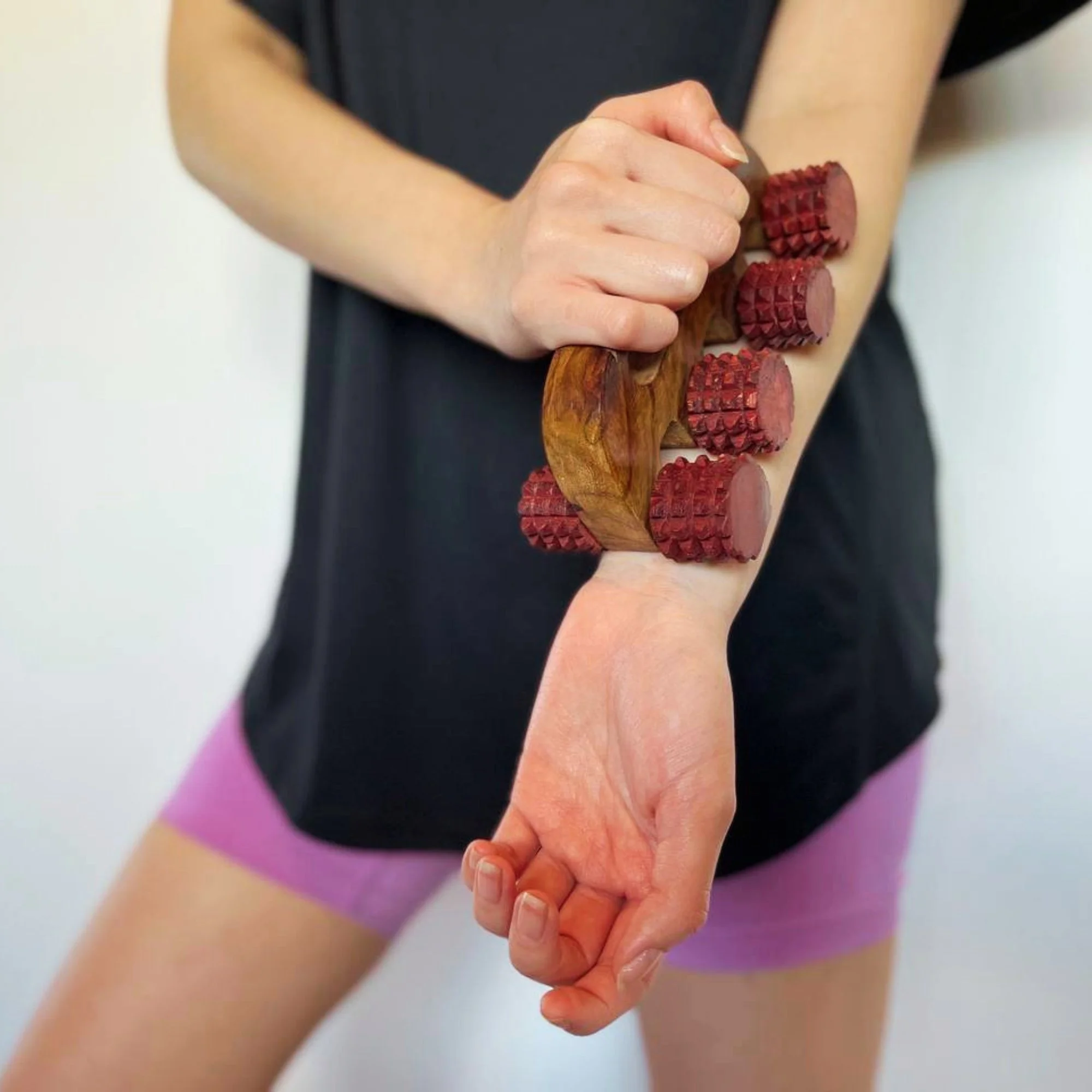 Handheld_wooden_deep_tissue_massager_forearm.jpg