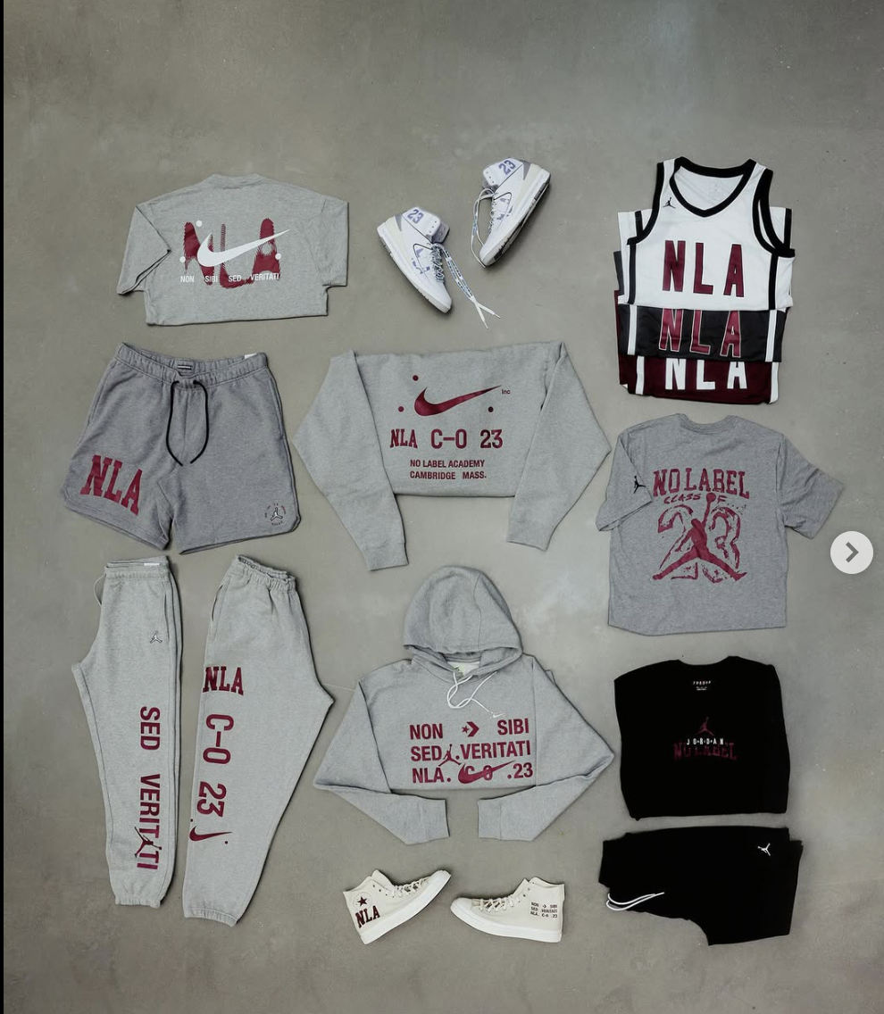 Athletic clothing and sneakers laid out on floor, including T-shirts, sweatshirts, sweatpants, and running shoes, with branding related to Nike and NLA.