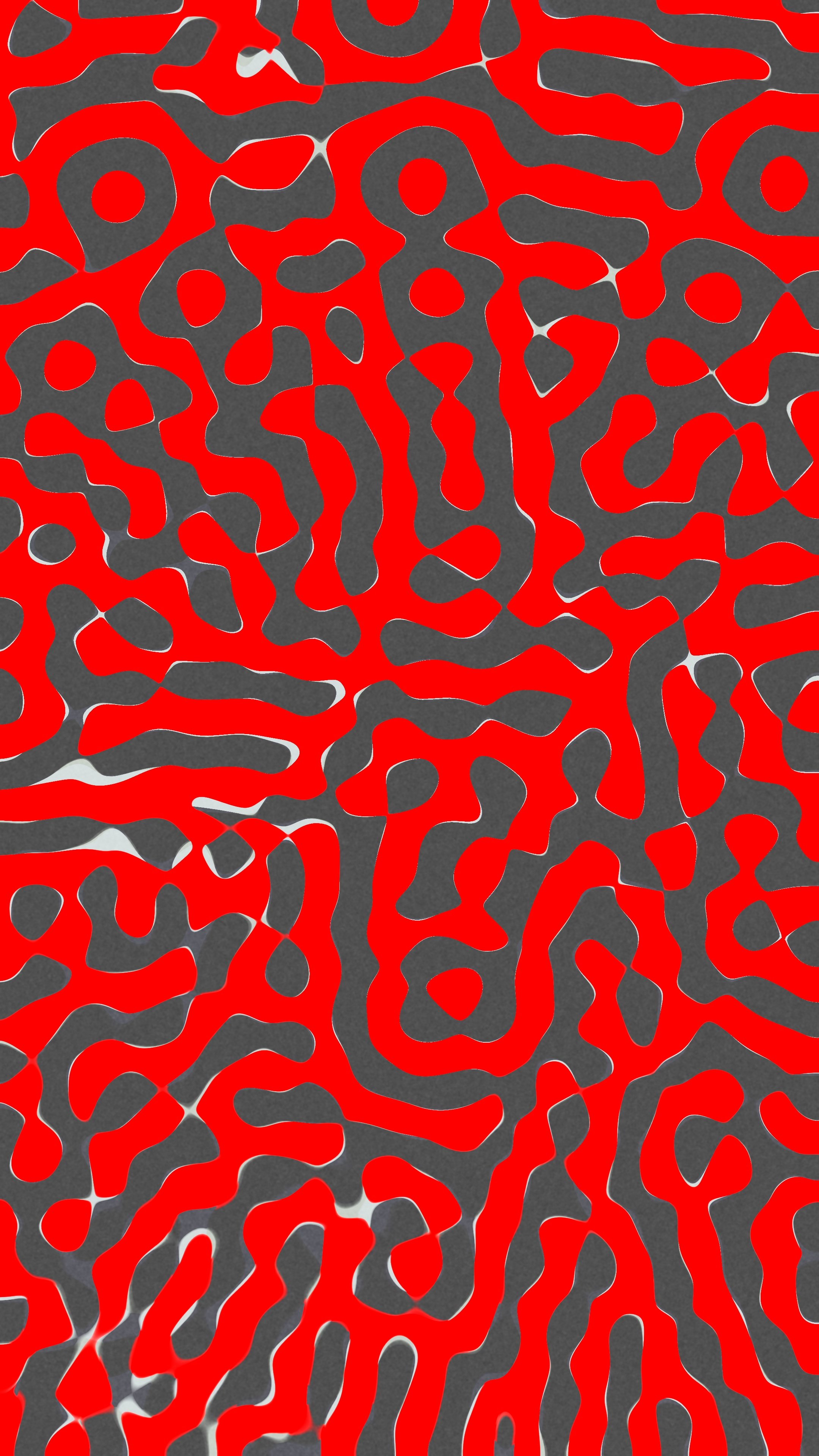 An abstract pattern resembling animal print, with irregular red shapes on a dark gray background.