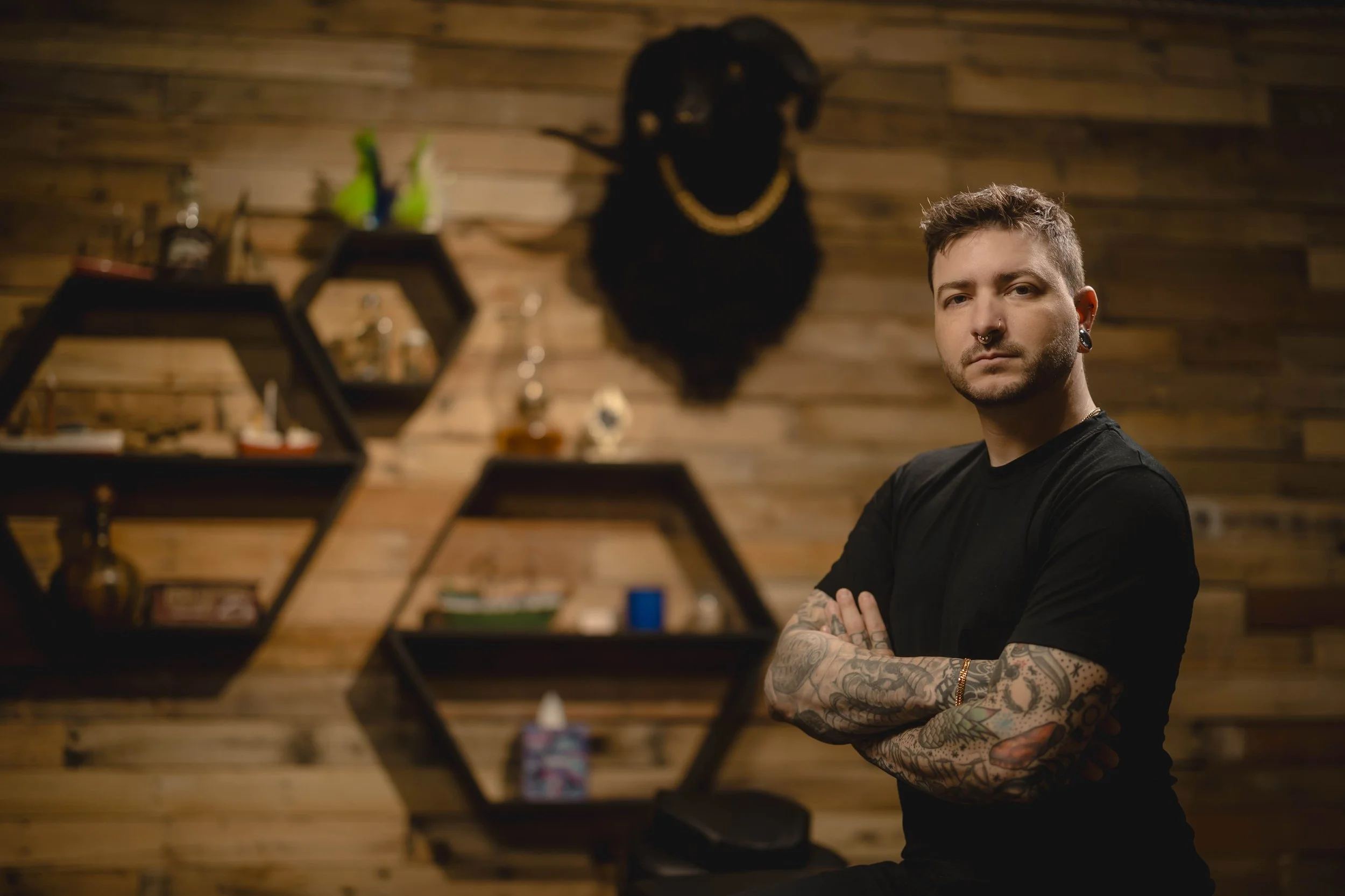 Iggy Luppino standing in the piercing room at Sink or Swim Tattoo and Piercing in Niagara Falls, NY