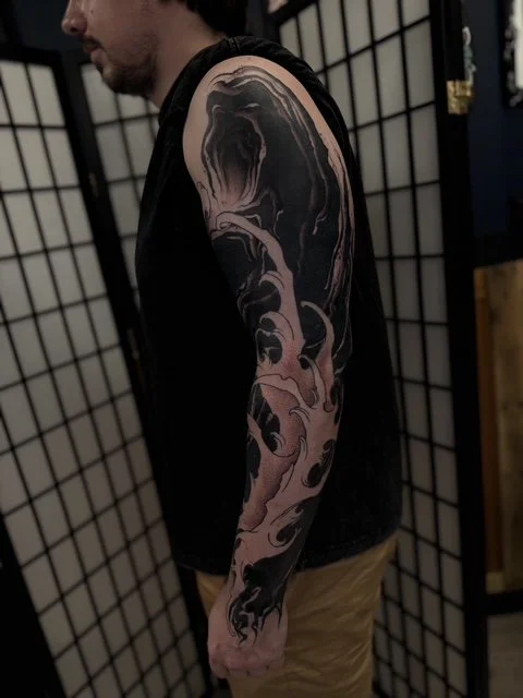 blackwork ornamental Japanese finger wave sleeve , portfolio work by Jordy Levea at sink or swim tattoo and piercing in Niagara Falls, ny