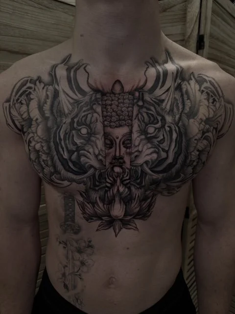 Japanese tiger and buddha black and grey chest tattoo , portfolio work by Jordy Levea at sink or swim tattoo and piercing in Niagara Falls, ny