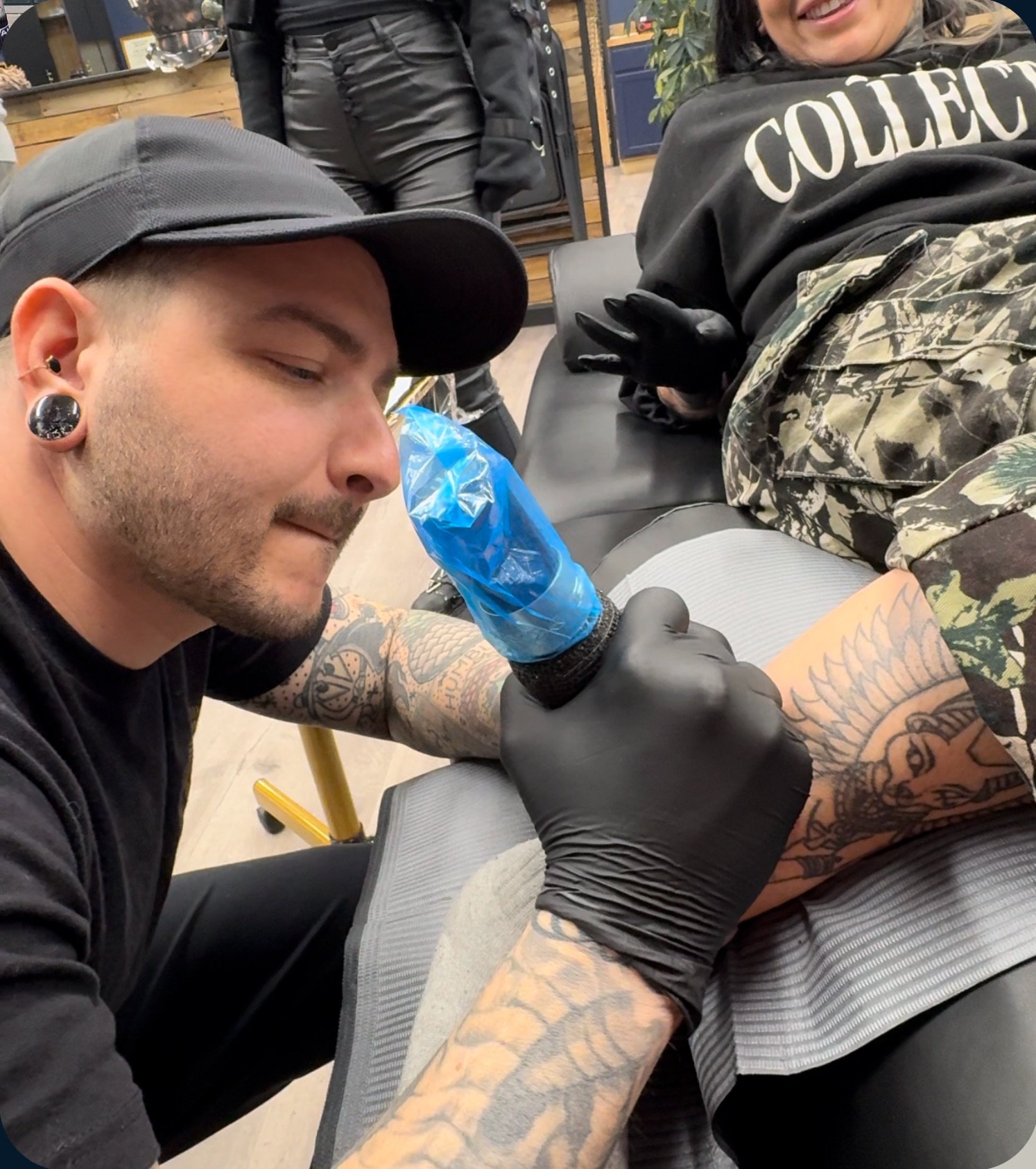 piercer Iggy Luppino performing a rare tattoo on another tattoo artist at sink or swim tattoo and piercing in niagara falls, ny
