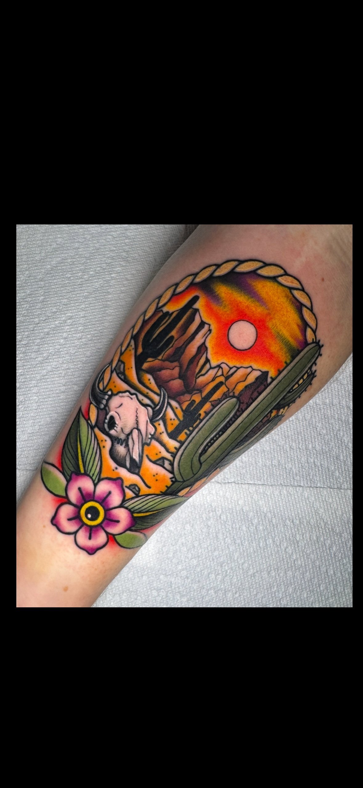 Traditional desert cactus landscape cowskull tattoo in color portfolio work by Shannon Kuzara at Sink or Swim Tattoo and Piercing in Niagara Falls NY