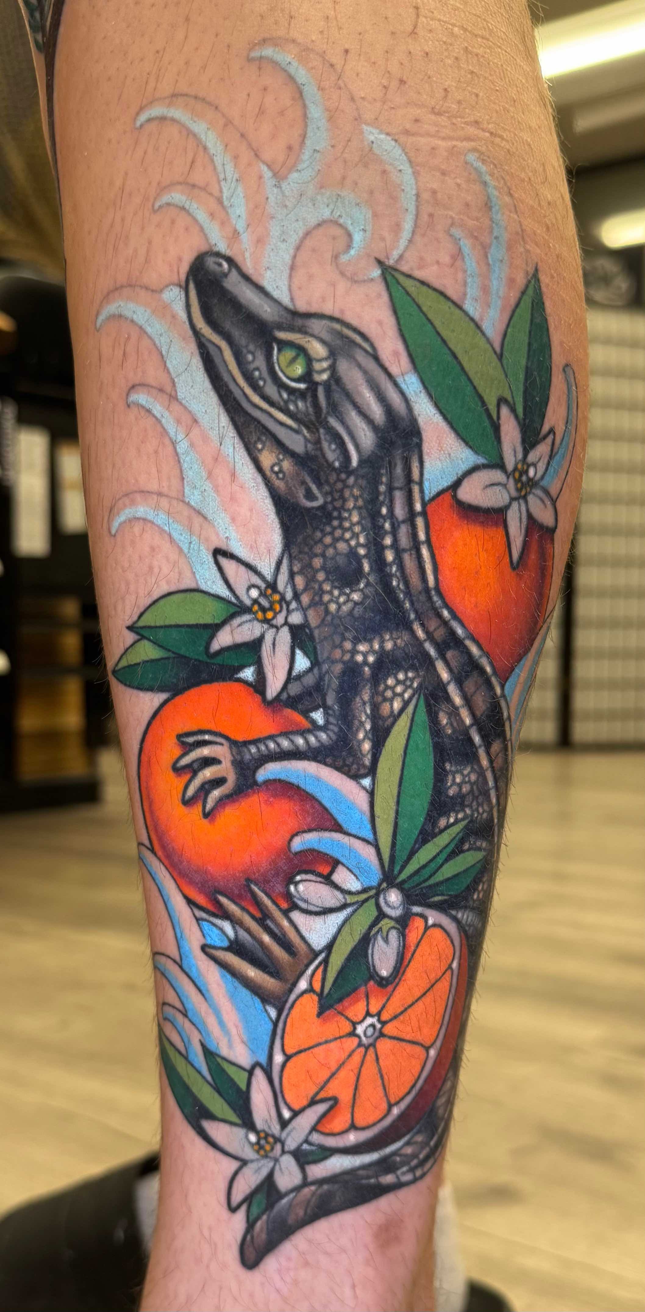 Neo traditional Florida themed tattoo of baby alligator and oranges in color portfolio work by Keith Kuzara at Sink or Swim Tattoo and Piercing in Niagara Falls NY
