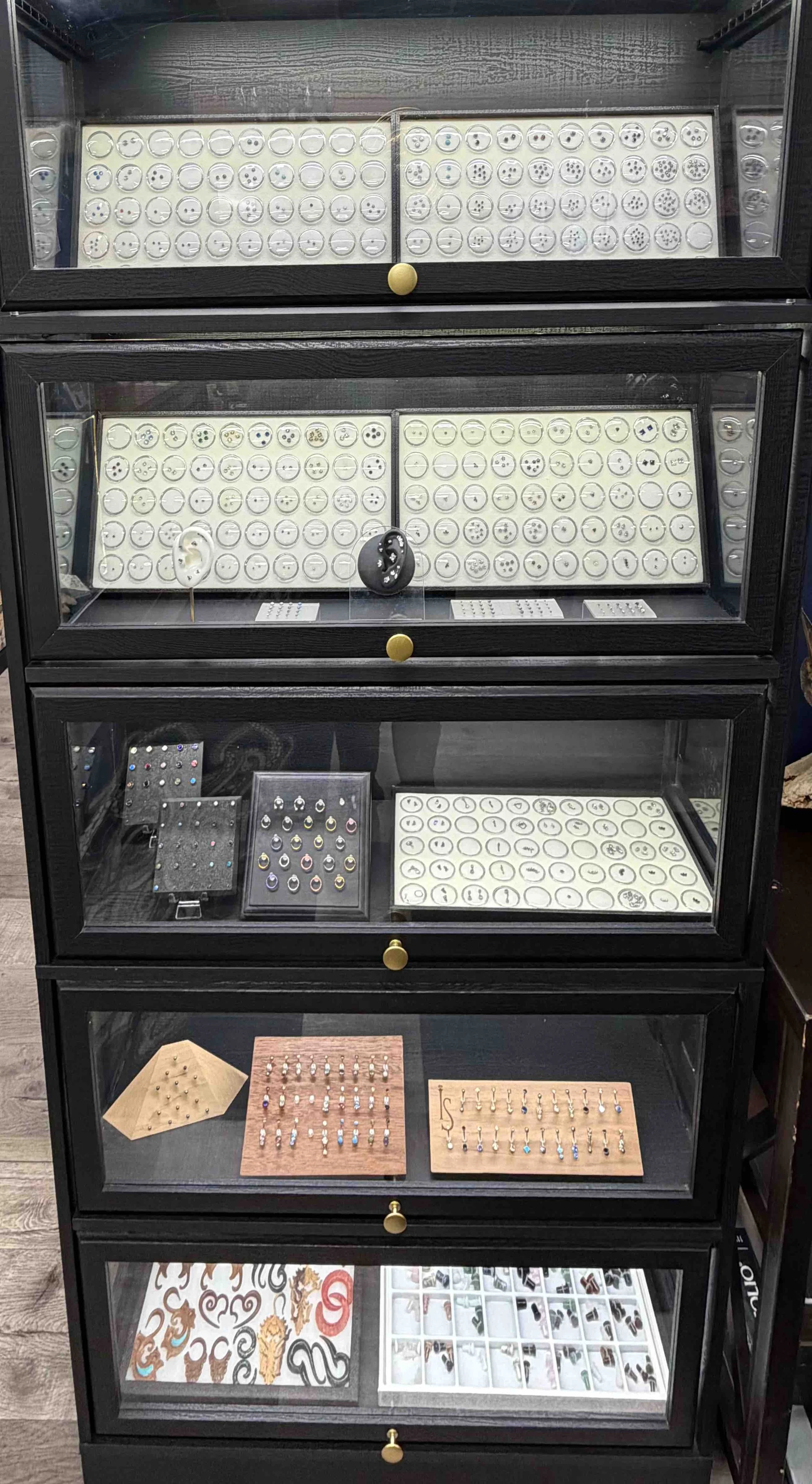 implant grade astm-136 Body jewelry display case at Sink or Swim Tattoo and Piercing in Niagara Falls, NY