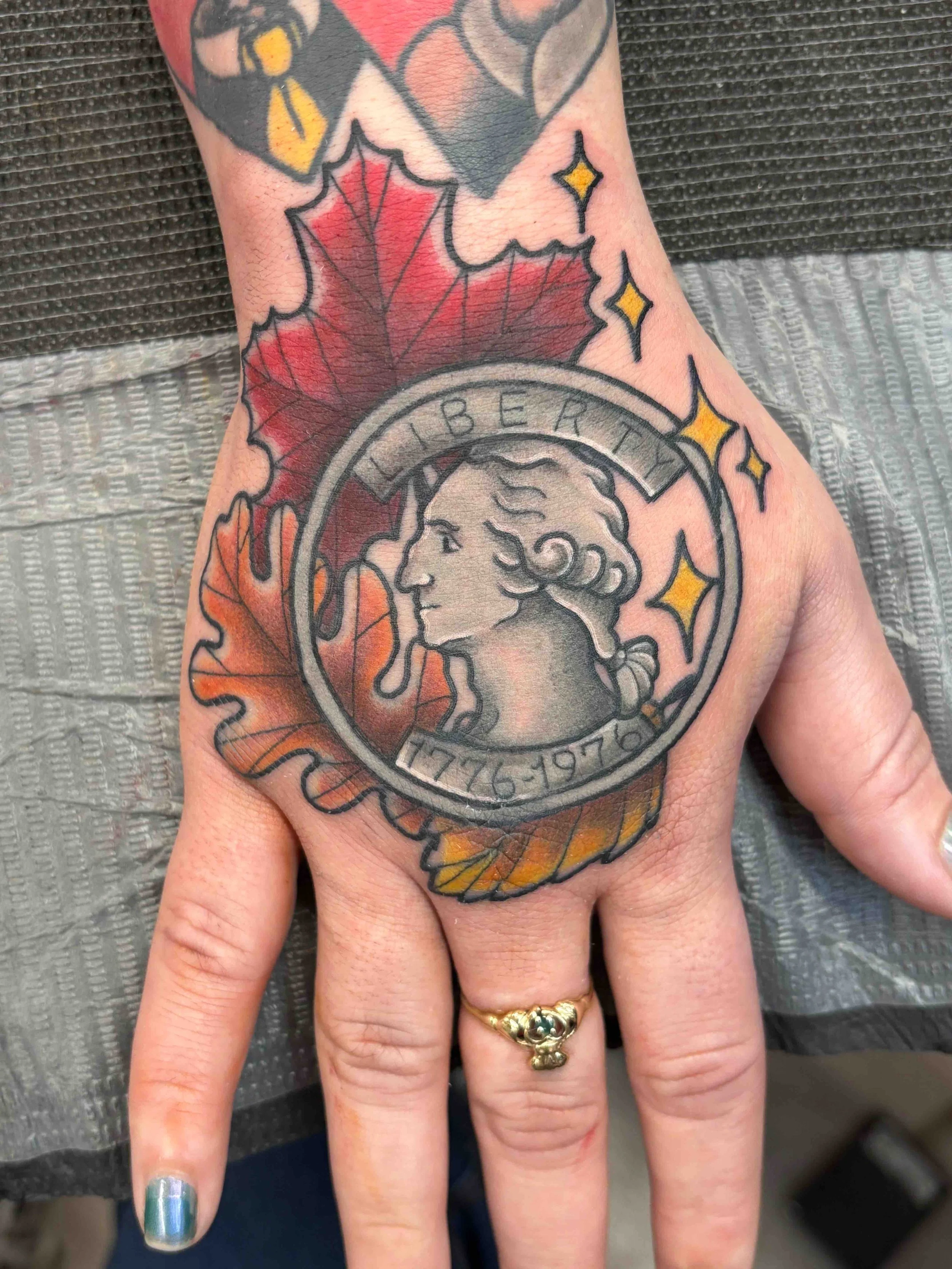 traditional style hand tattoo, portfolio work by Sam Sullivan at Sink or Swim Tattoo and Piercing in Niagara Falls, NY