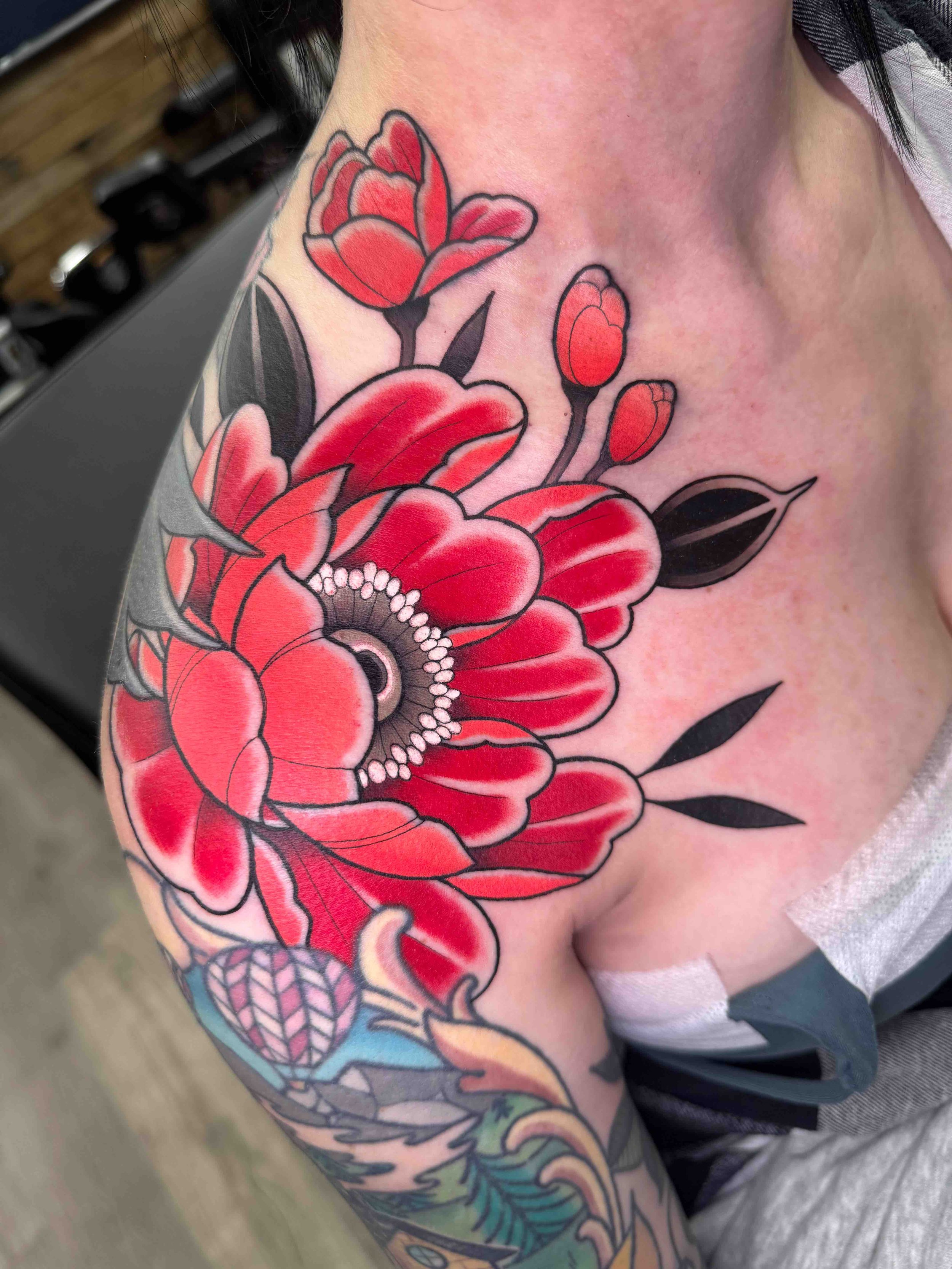 Neo traditional peony flowers tattoo in color portfolio work by Keith Kuzara at Sink or Swim Tattoo and Piercing in Niagara Falls NY