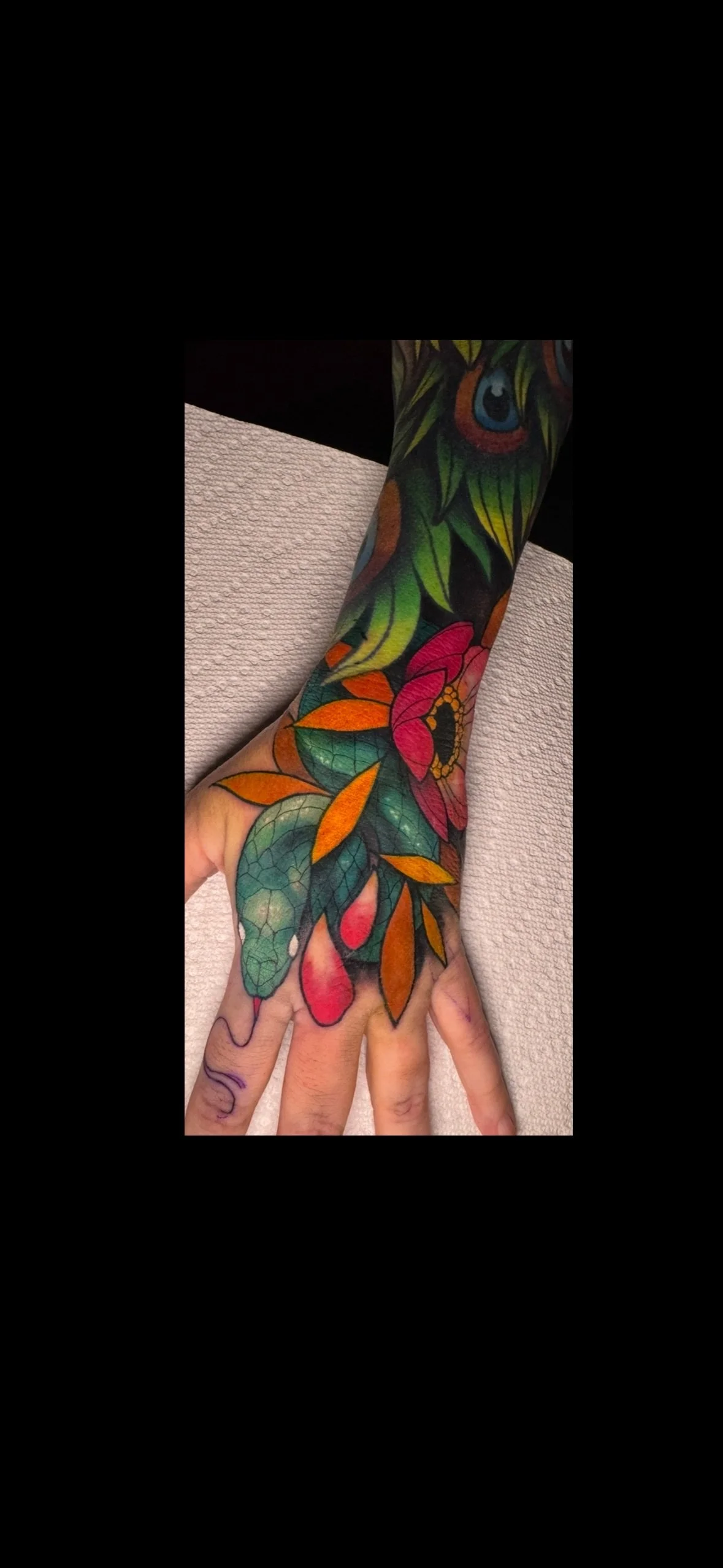 Neo traditional snake and flower hand tattoo in color portfolio work by Shannon Kuzara at Sink or Swim Tattoo and Piercing in Niagara Falls NY