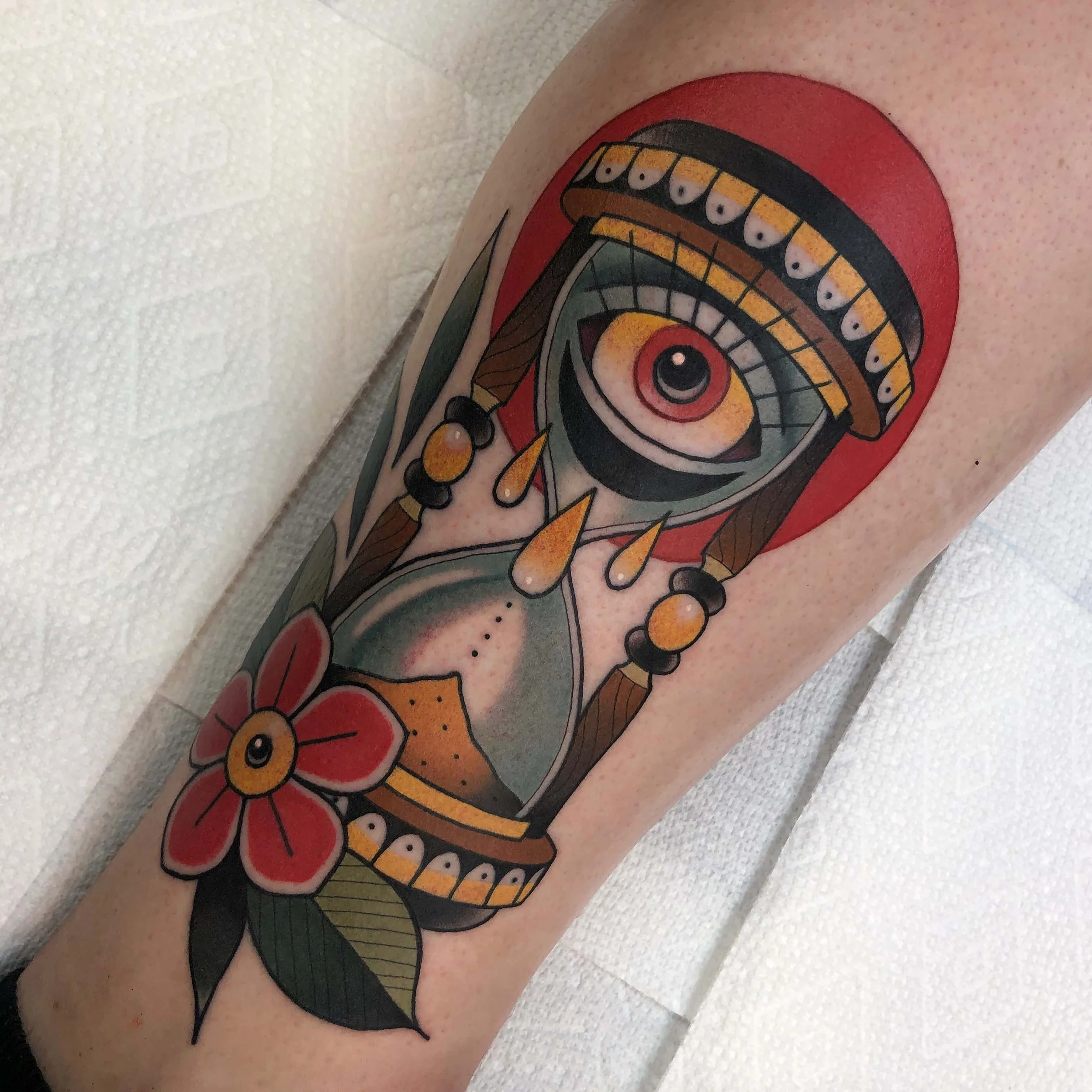Traditional hourglass with eye tattoo in color portfolio work by Keith Kuzara at Sink or Swim Tattoo and Piercing in Niagara Falls NY