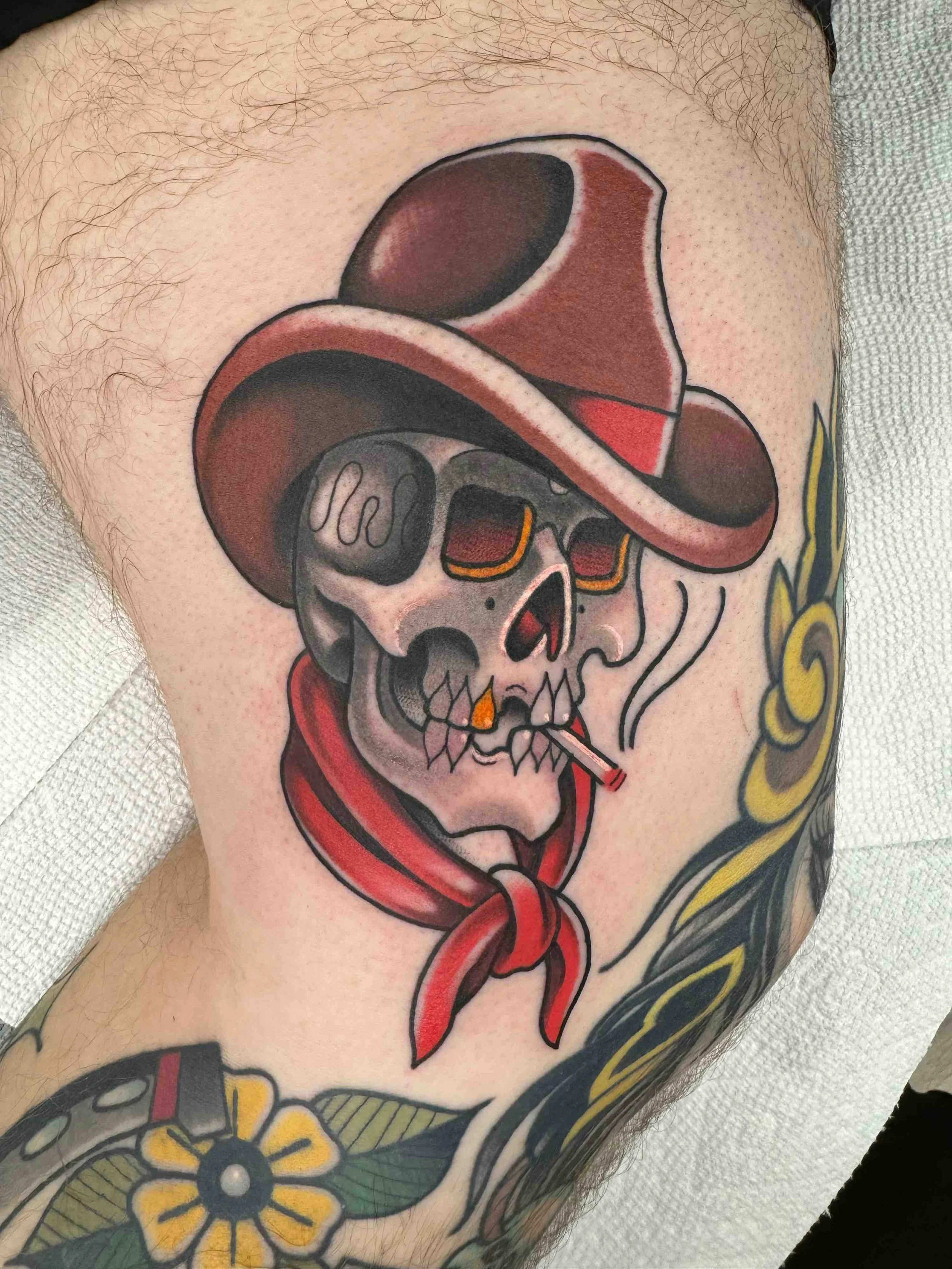 Traditional skull cowboy smoking a cigarette tattoo in color portfolio work by Keith Kuzara at Sink or Swim Tattoo and Piercing in Niagara Falls NY