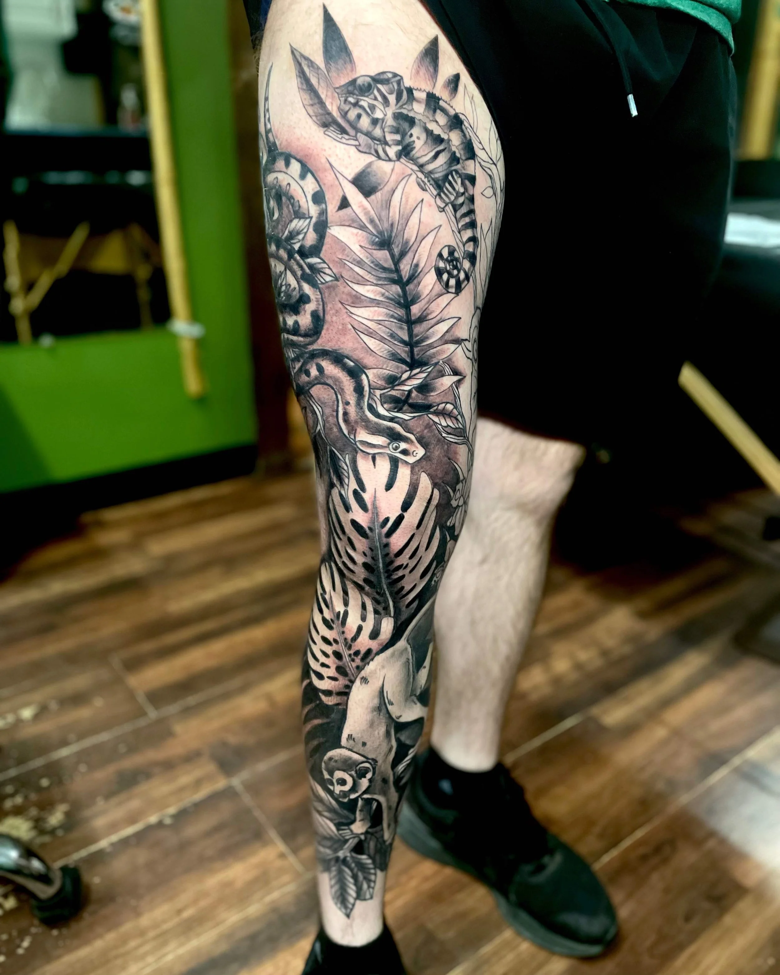 Black and grey illustrative full leg tiger tattoo, portfolio work by Emily Quartley at Sink or Swim Tattoo and Piercing in Niagara Falls, NY