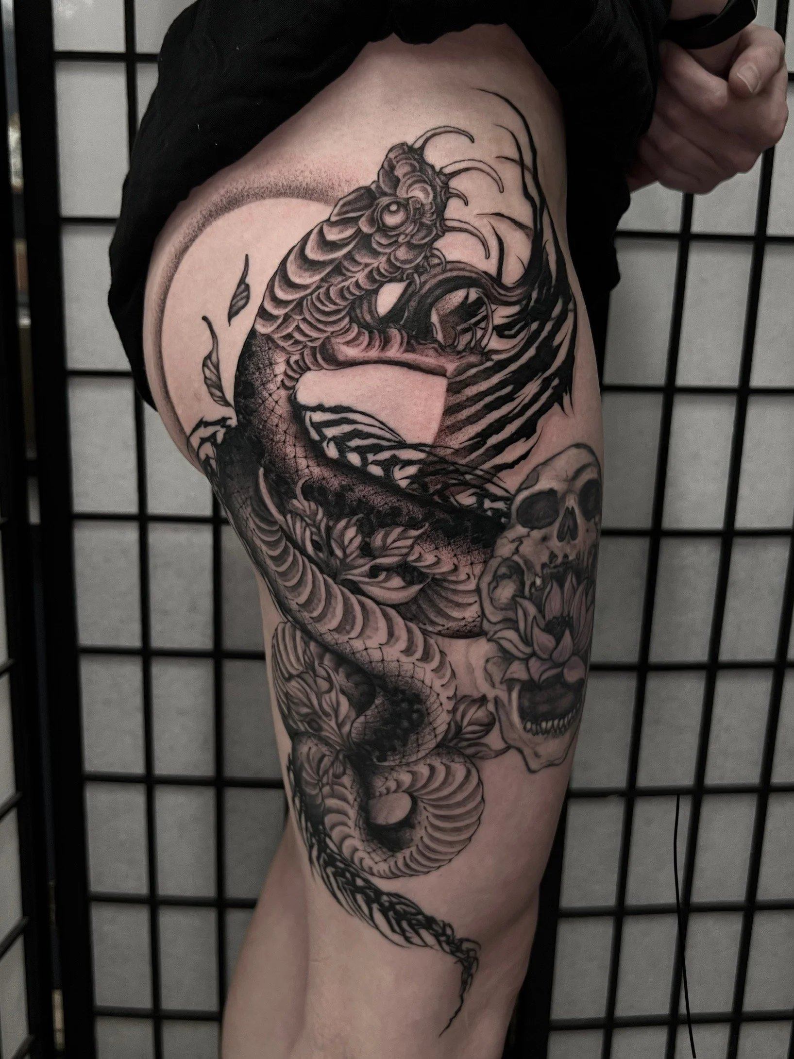 dark art black and grey japanese snake with blackwork ornamental thigh tattoo , portfolio work by Jordy Levea at sink or swim tattoo and piercing in Niagara Falls, ny