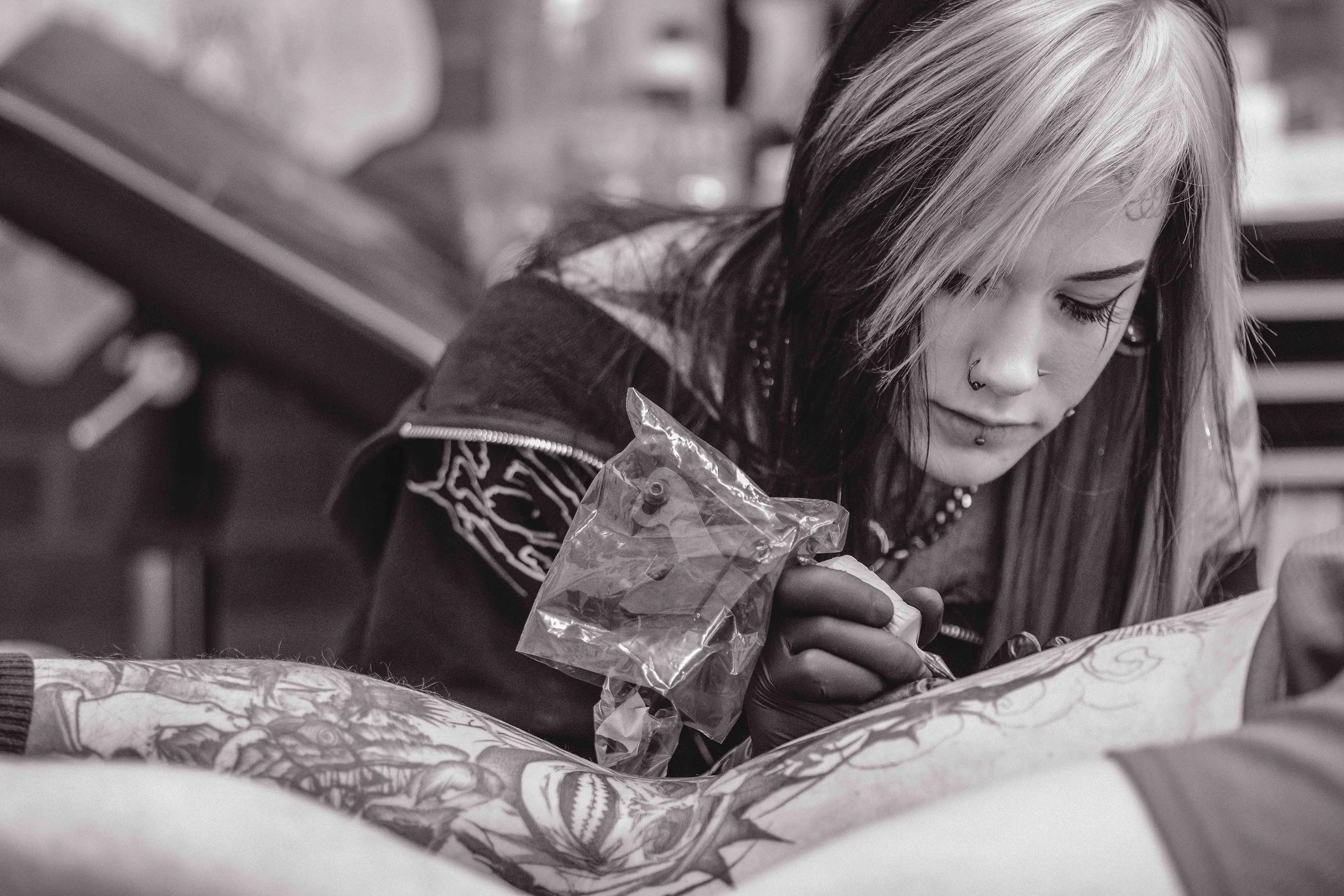 Jordy tattooing a client at sink or swim in Niagara Falls, ny