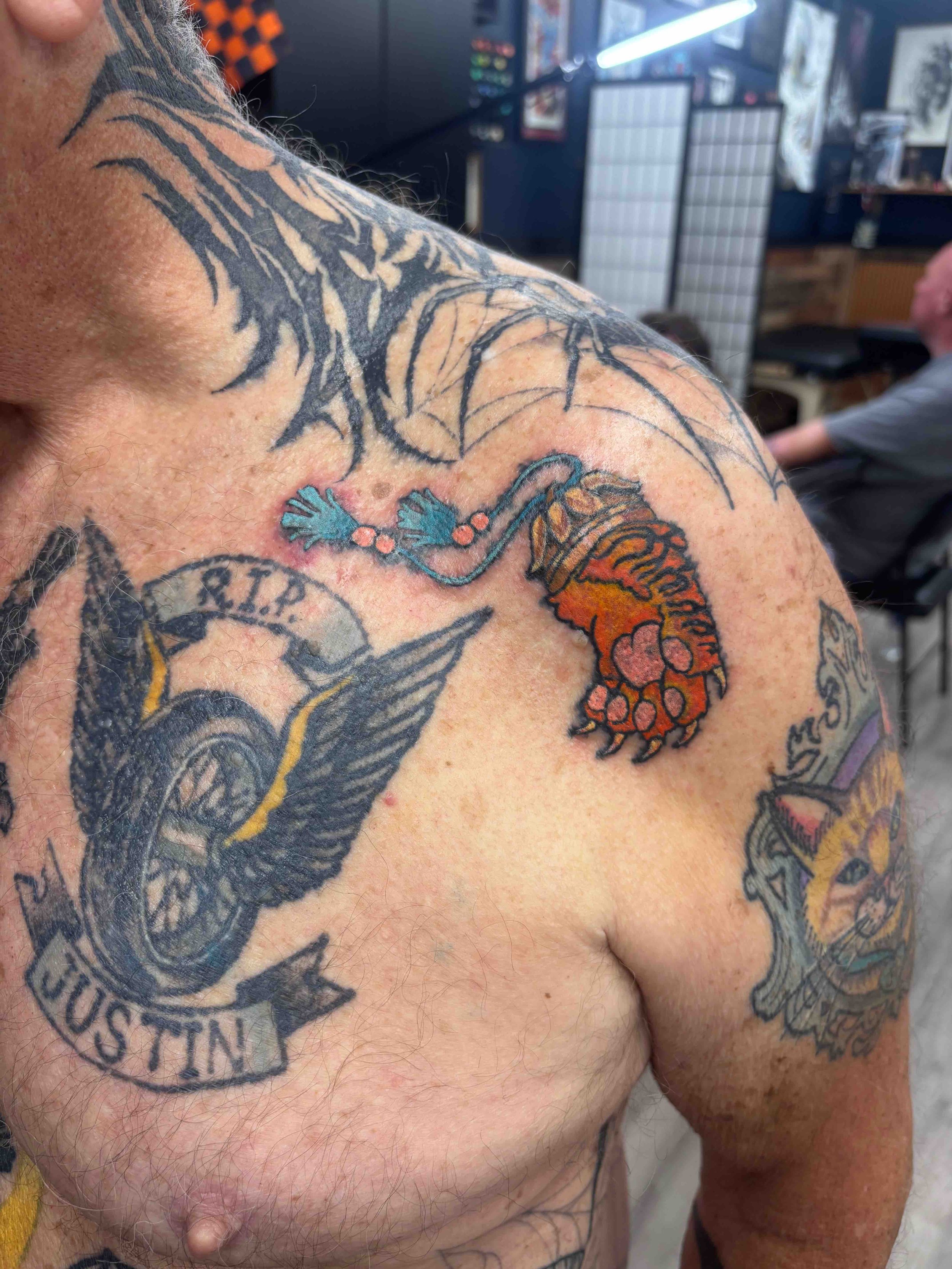 Neo traditional color tiger paw tattoo on chest by AK Zaionz at Sink or Swim in Niagara Falls NY