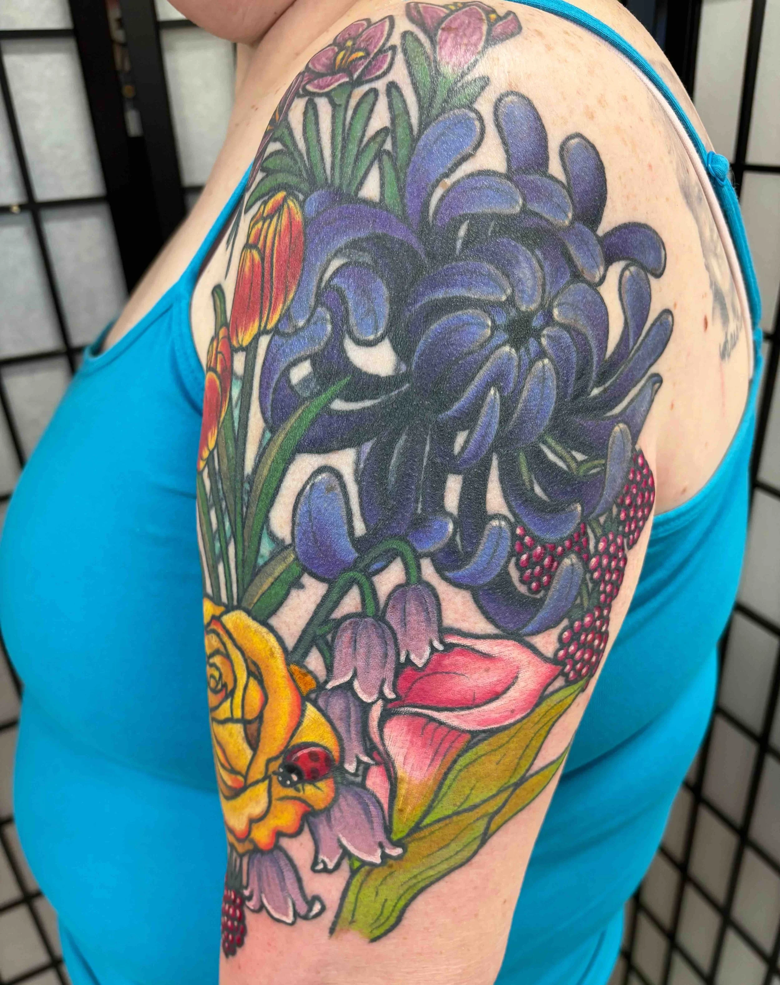 flower cover up tattoo, portfolio work by Samantha Sullivan at Sink or Swim Tattoo and Piercing in Niagara Falls, NY