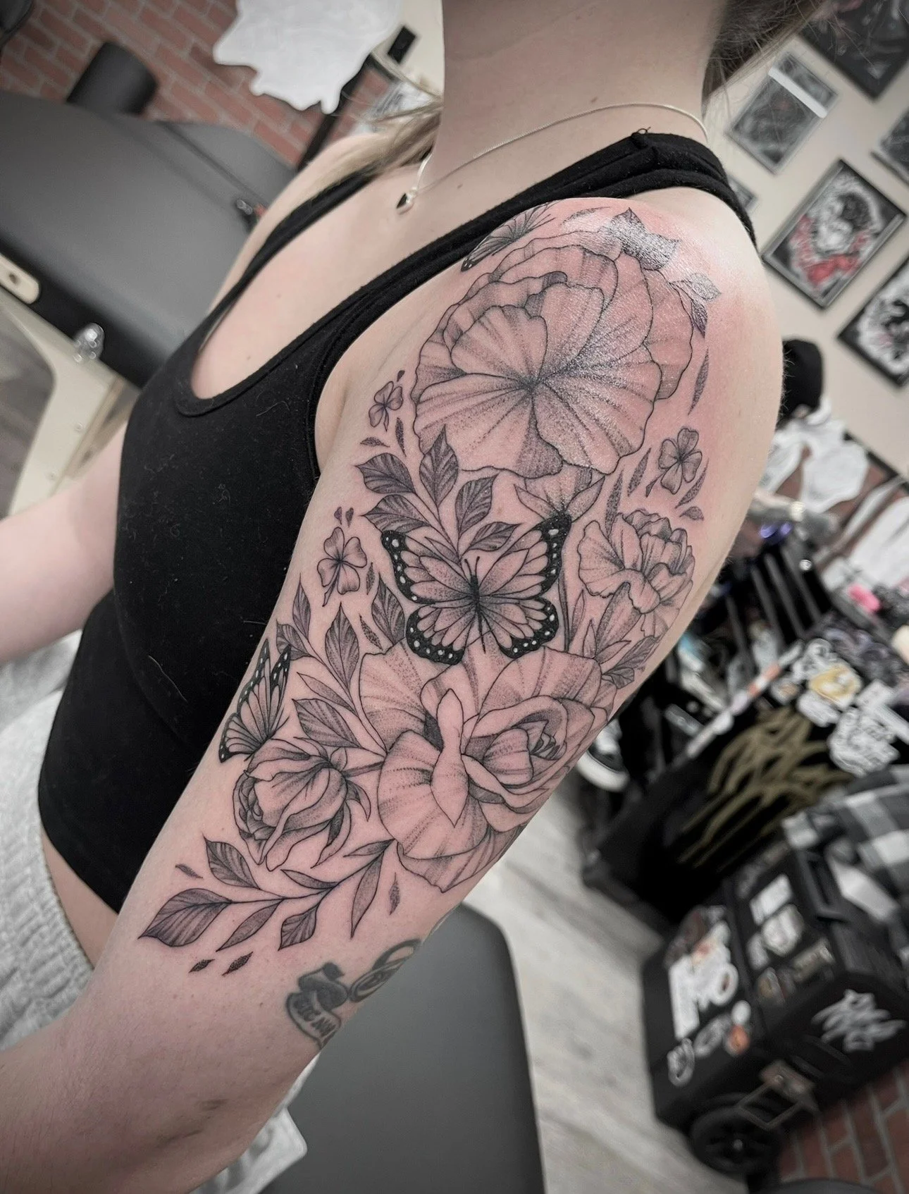 fine line, floral tattoo on upper arm , portfolio work by Brooke Canzoneri at sink or swim tattoo and piercing in Niagara Falls, ny