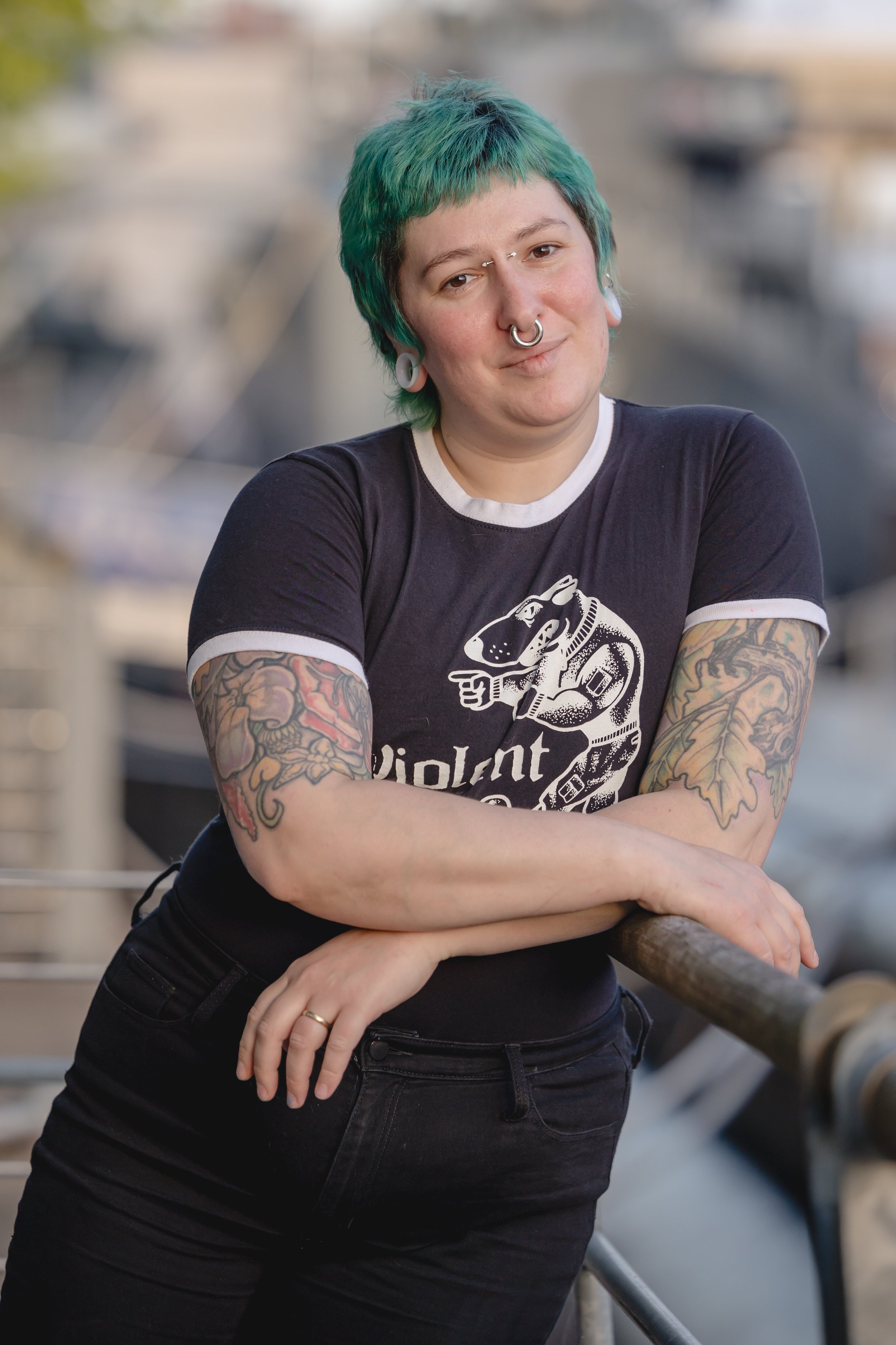 Studio headshot portrait of a resident tattoo and body piercing apprentice on the crew team at Sink or Swim Tattoo and Piercing