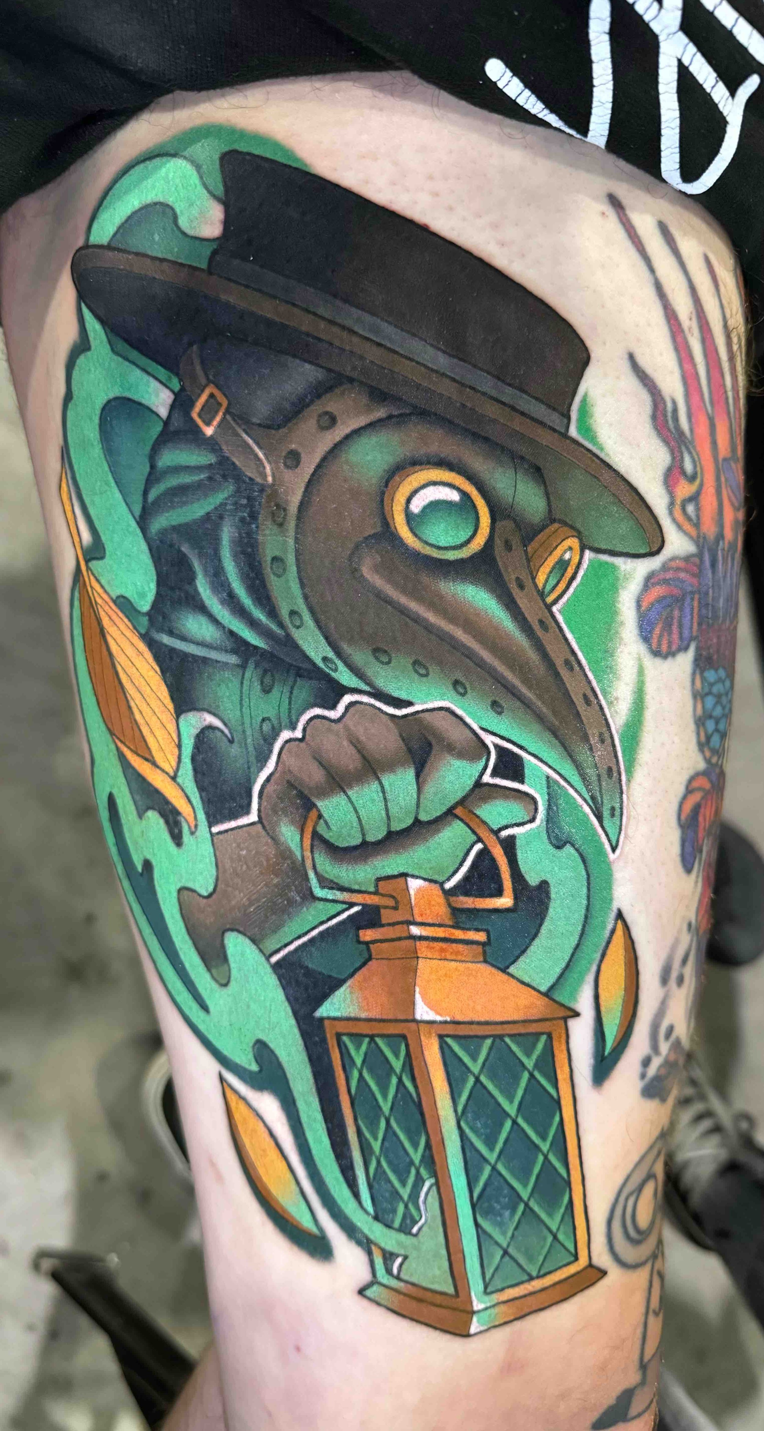 award winning tattoo of a Neo traditional plague doctor holding a lantern, portfolio work by Keith Kuzara at Sink or Swim Tattoo and Piercing in Niagara Falls NY