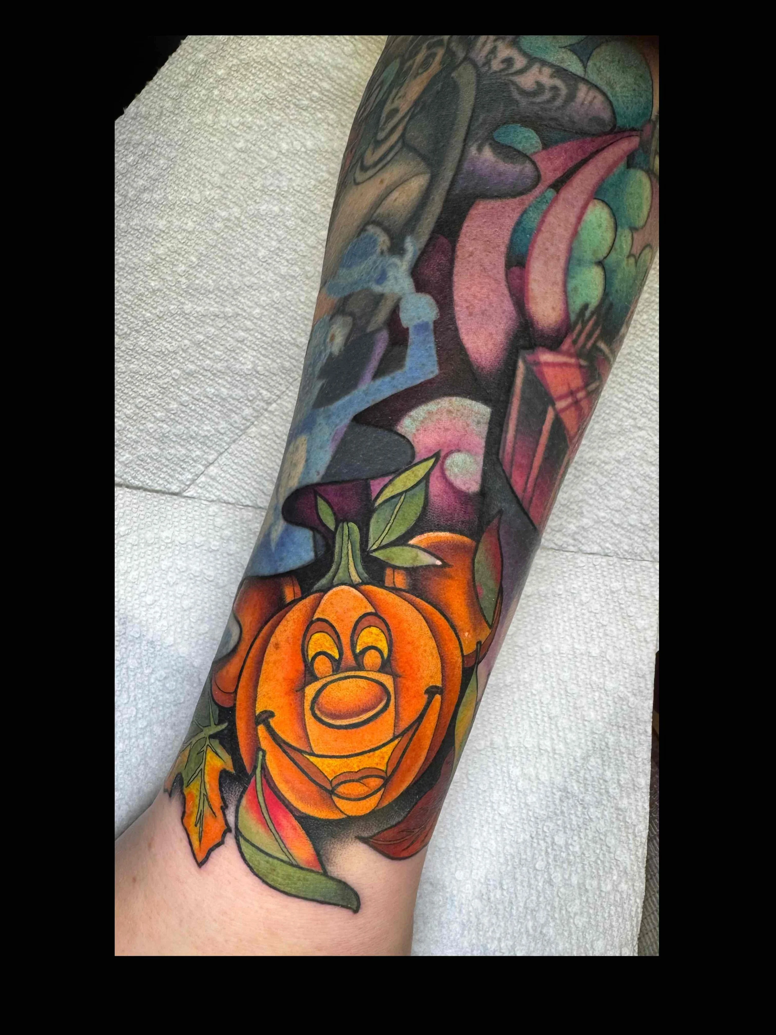 Neo traditional Disney Mickey pumpkin tattoo in color portfolio work by Shannon Kuzara at Sink or Swim Tattoo and Piercing in Niagara Falls NY