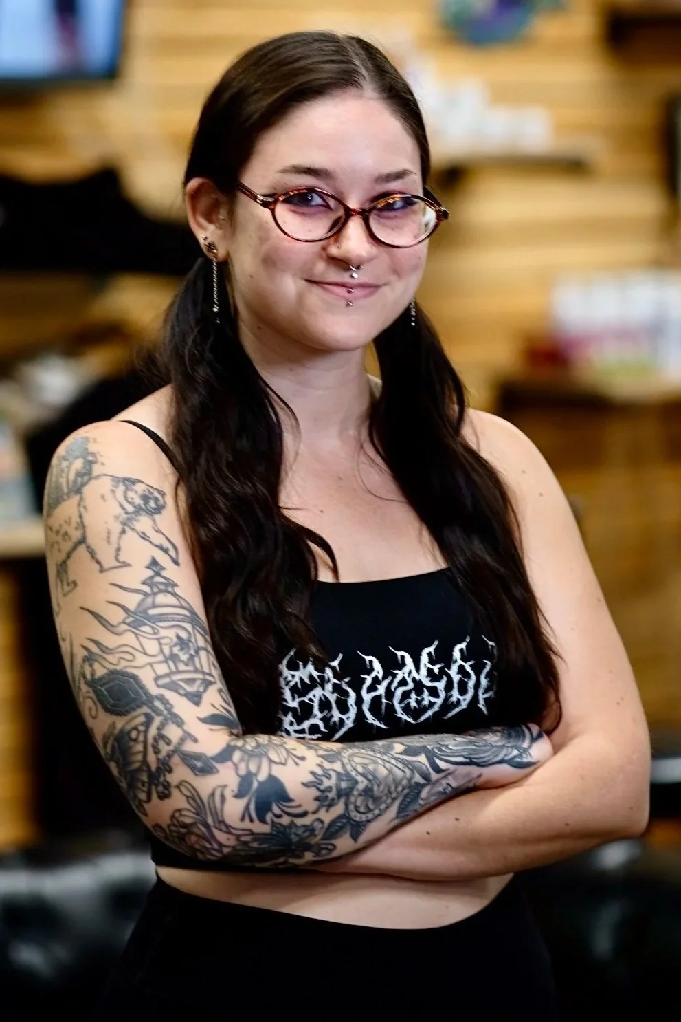 Studio portrait of resident tattoo artist Emily quartley on the crew team at Sink or Swim Tattoo and Piercing