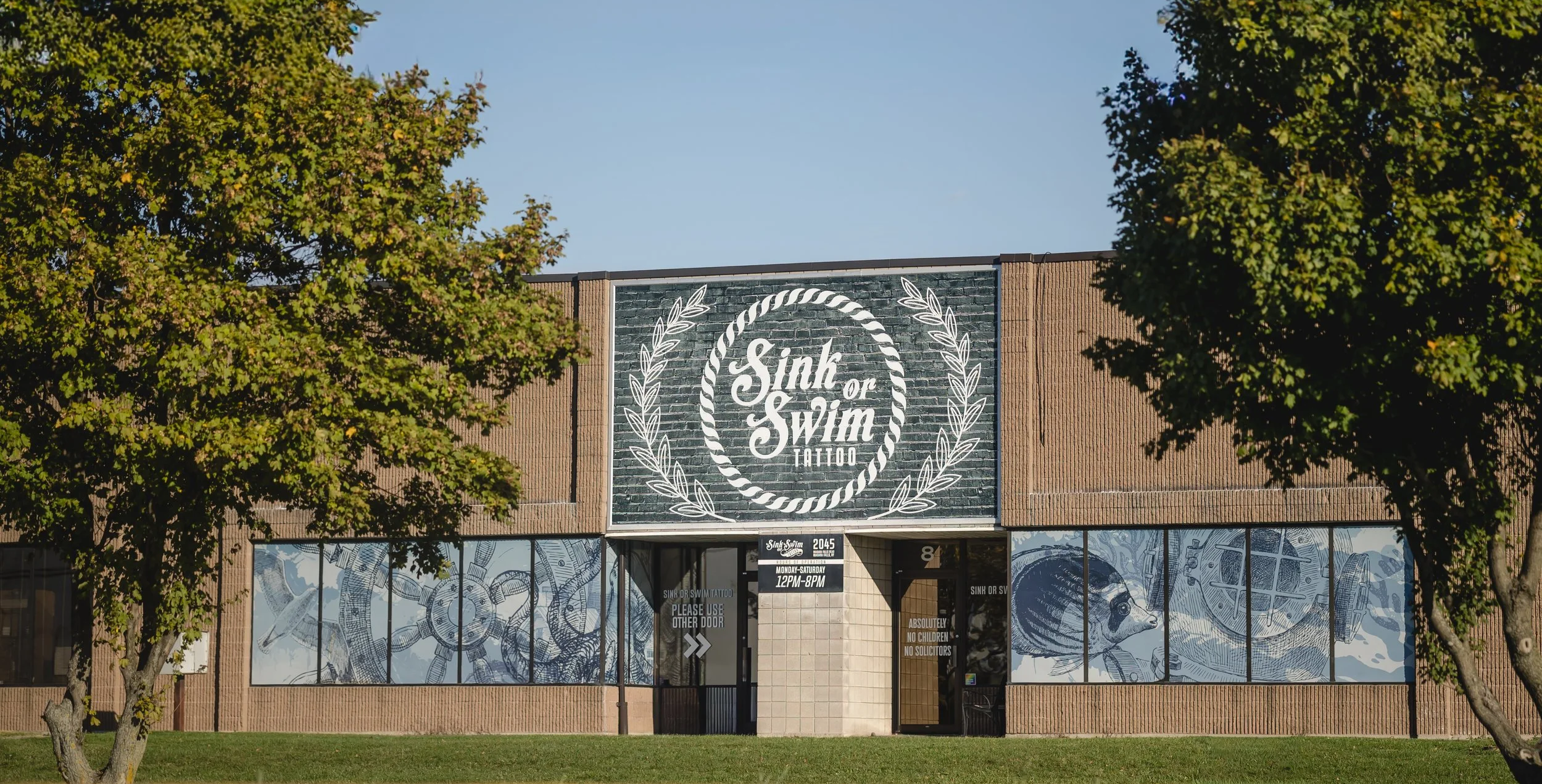 Sink or Swim Tattoo and Piercing shop front with storefront signage in Niagara Falls, New York