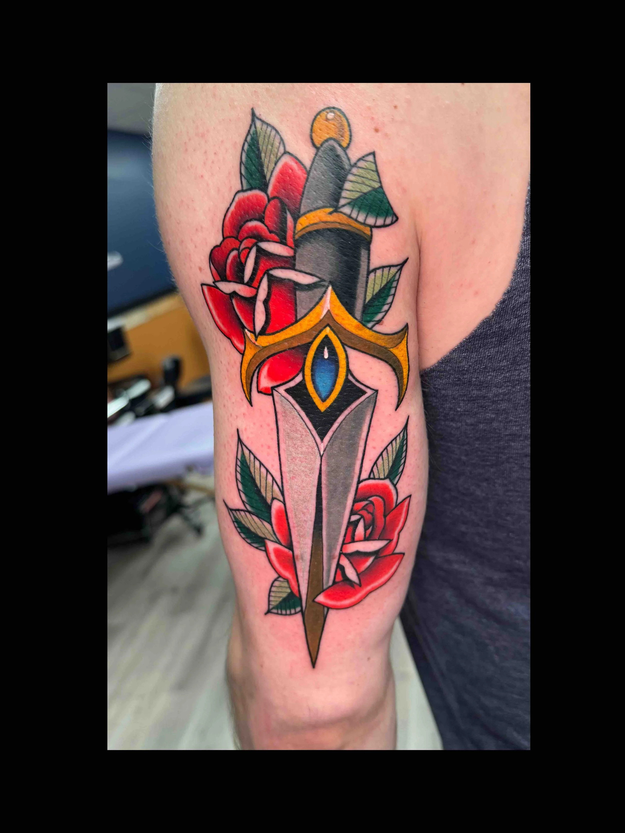 Neo traditional dagger and roses tattoo in color portfolio work by Keith Kuzara at Sink or Swim Tattoo and Piercing in Niagara Falls NY