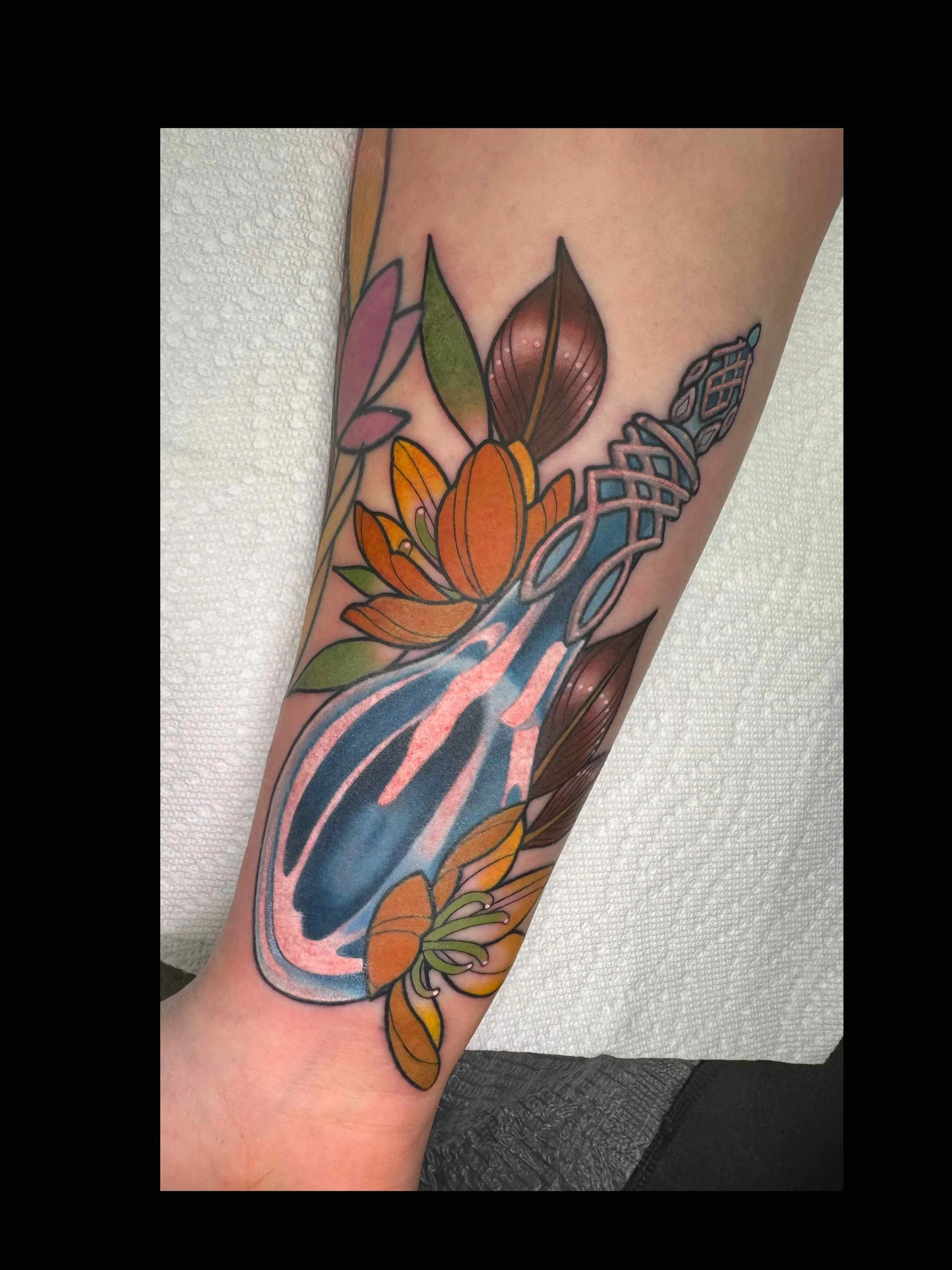 shannon-kuzara-lord-of-the-rings-bottle-flowers-phial-of-galadriel-tattoo-sink-or-swim-niagara-falls-ny.jpg