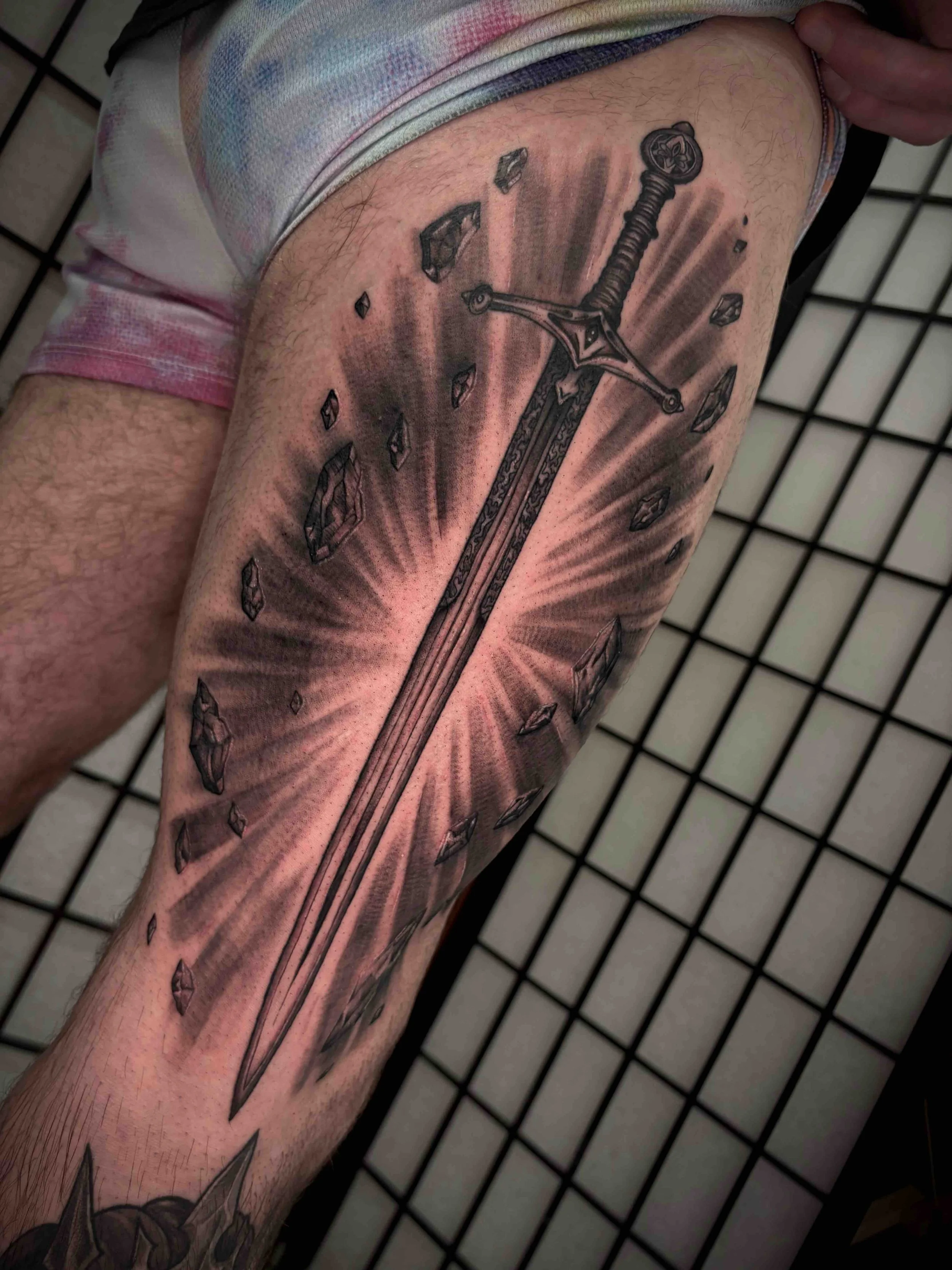 sword, black and grey style tattoo side hip tattoo , portfolio work by Brooke Canzoneri at sink or swim tattoo and piercing in Niagara Falls, ny