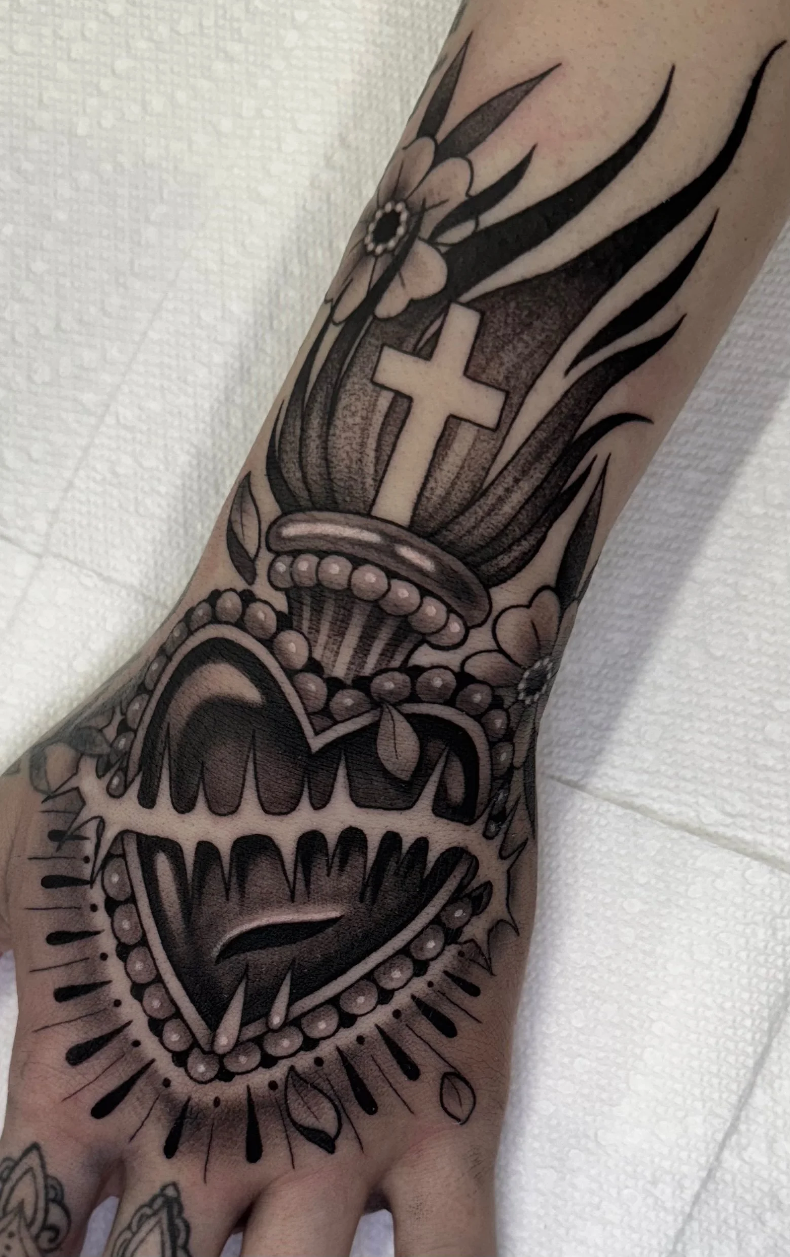 Neo traditional sacred heart tattoo in black and grey with stipple portfolio work by Keith Kuzara at Sink or Swim Tattoo and Piercing in Niagara Falls NY