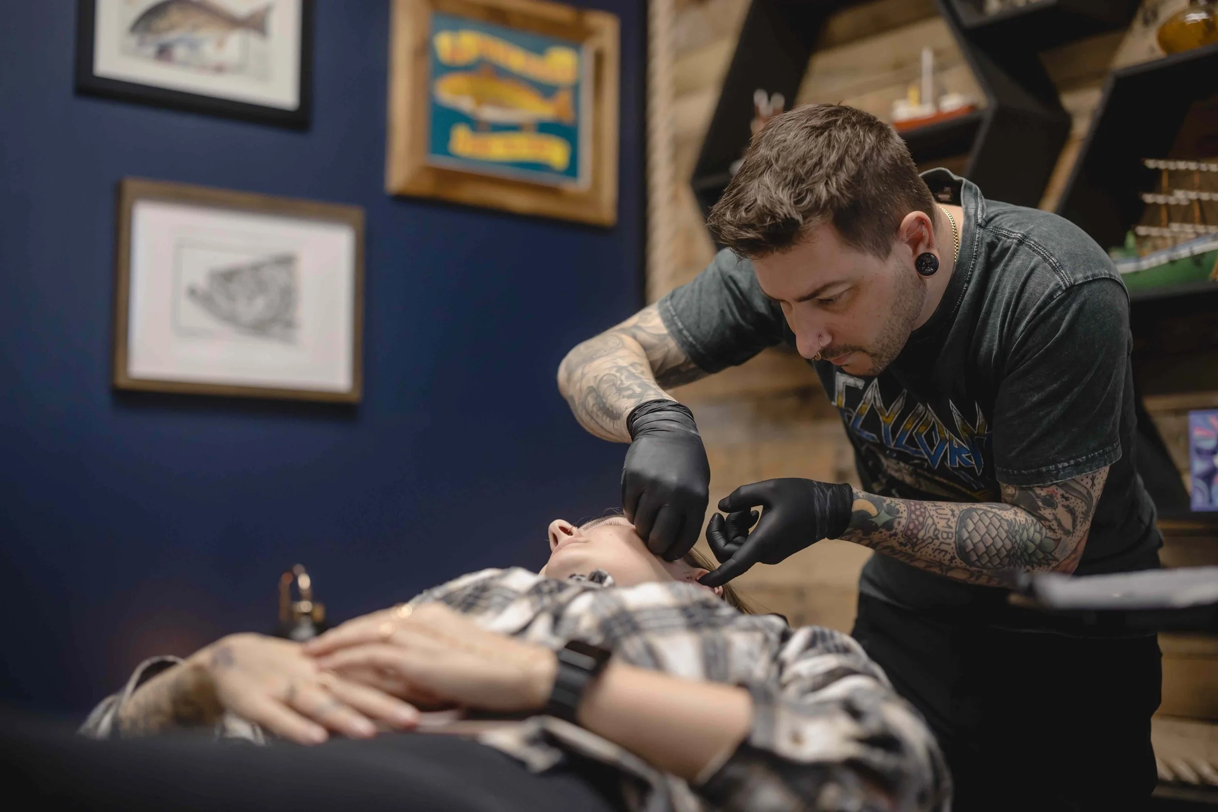 Iggy Luppino performing a jewelry change at Sink or Swim Tattoo and Piercing in Niagara Falls, NY