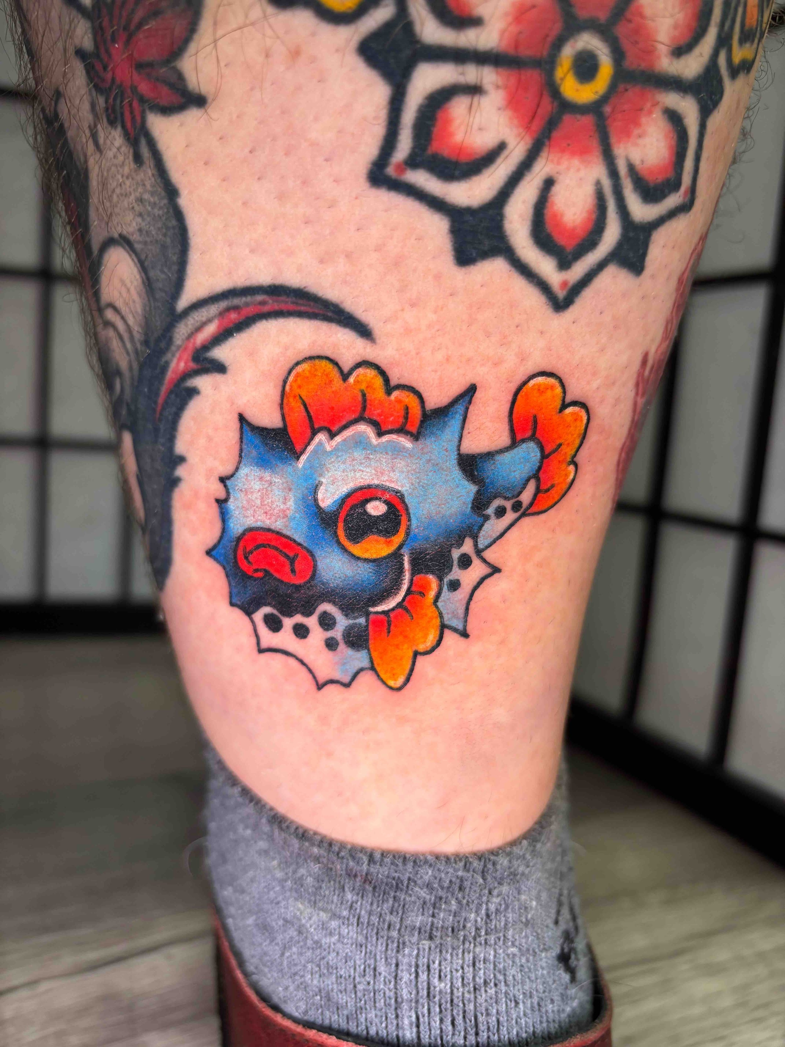 Neo Traditional puffer fish color tattoo on the ankle by AK Zaionz at Sink or Swim in Niagara Falls NY