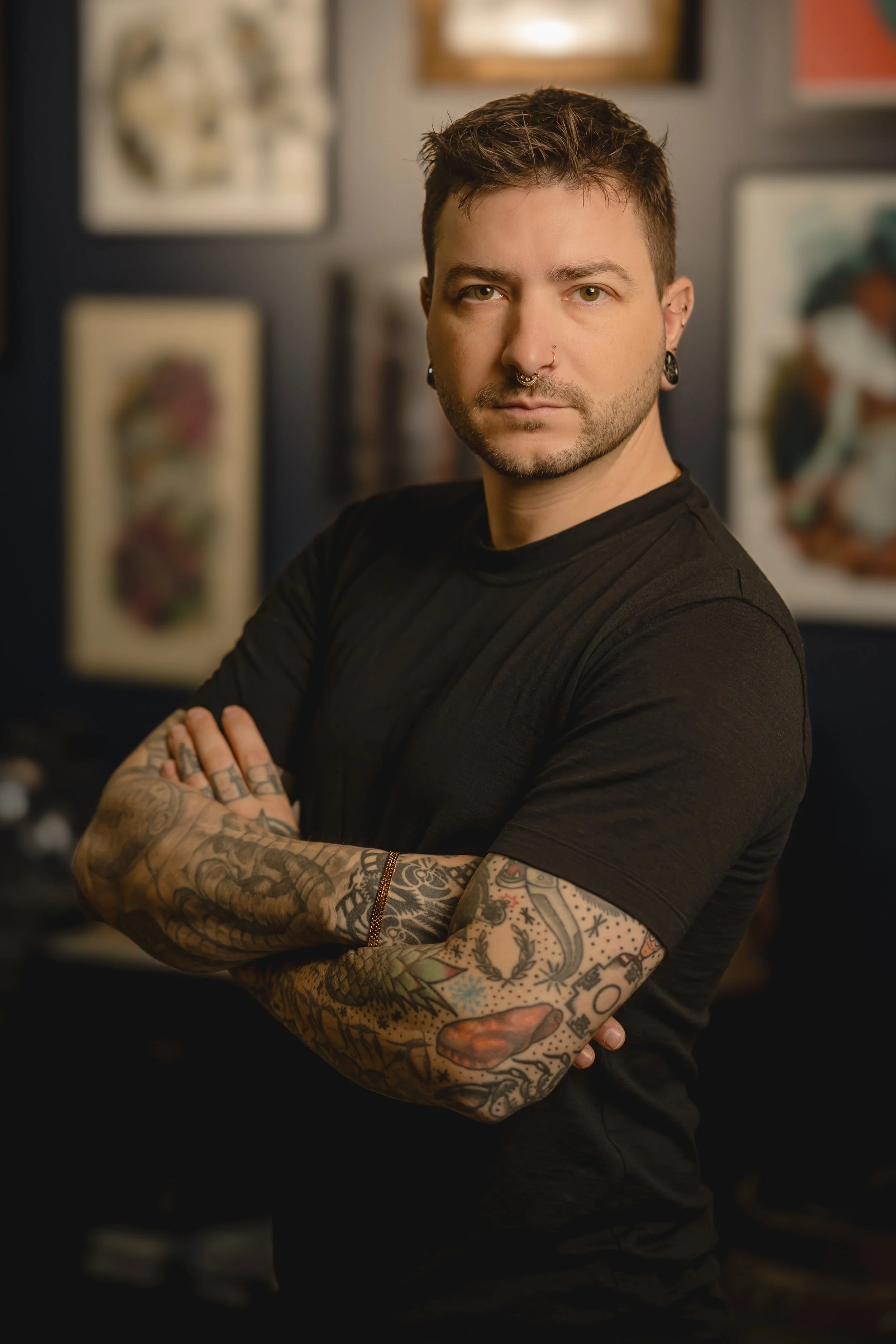 Studio headshot portrait of professional body piercer Iggy Luppino known for ear curations and use of quality jewelry at Sink or Swim Tattoo and Piercing