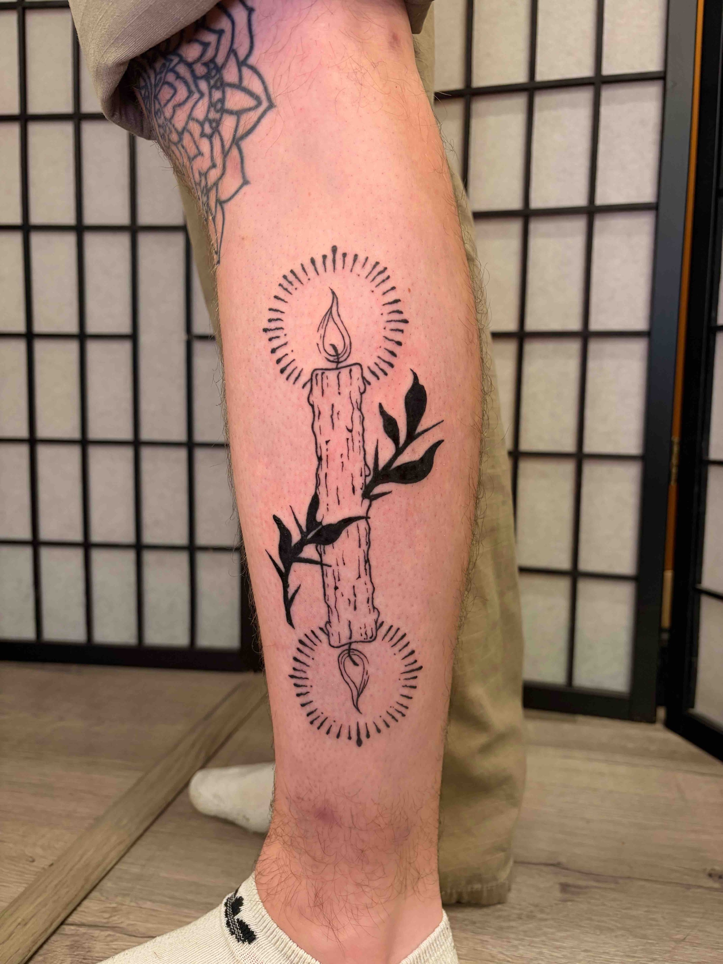 black-and-grey-woodcut-candle-tattoo-sink-or-swim-niagara-falls-ny.jpg