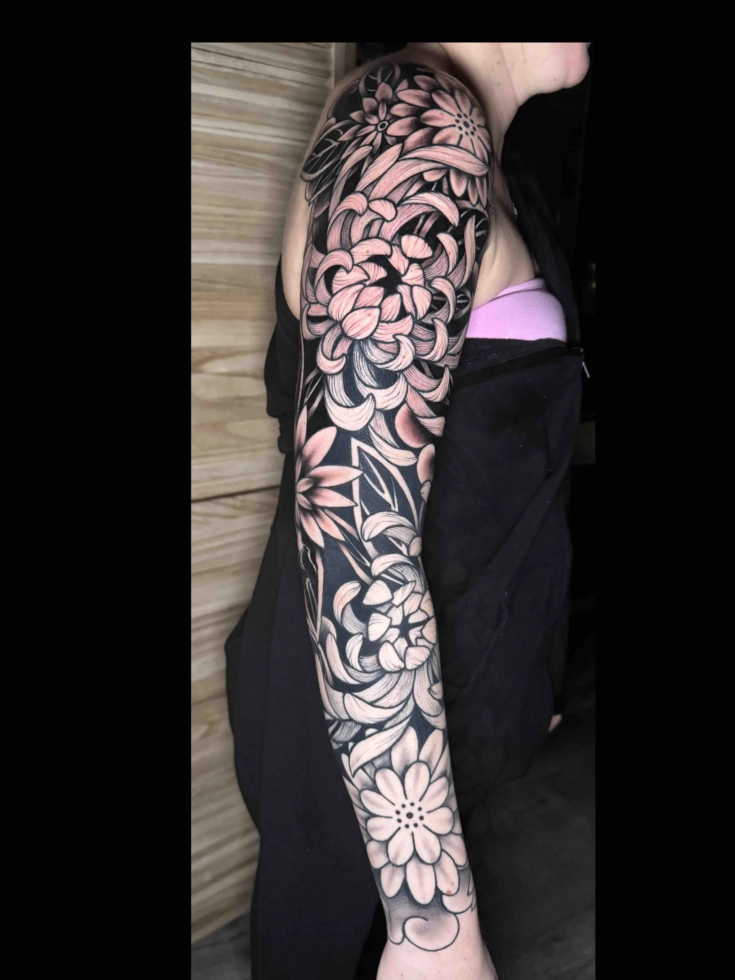 Japanese style full flower sleeve tattoo in black and grey portfolio work by Shannon Kuzara at Sink or Swim Tattoo and Piercing in Niagara Falls NY