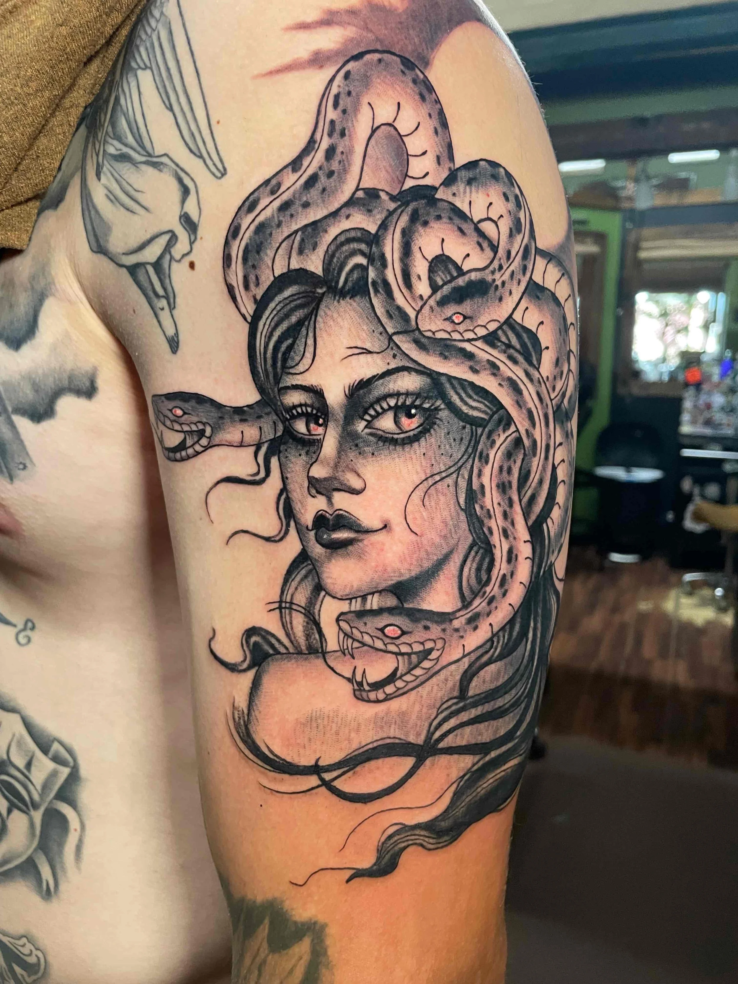 Black and grey medusa tattoo, portfolio work by Emily Quartley at Sink or Swim Tattoo and Piercing in Niagara Falls, NY