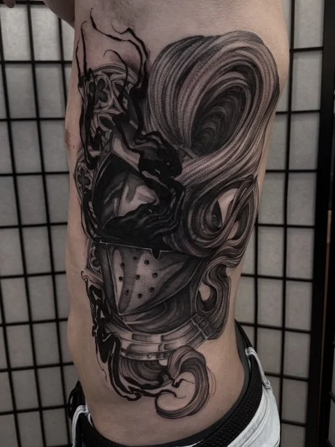 dark art black and grey medieval knight helmet with cathedral window tattoo , portfolio work by Jordy Levea at sink or swim tattoo and piercing in Niagara Falls, ny