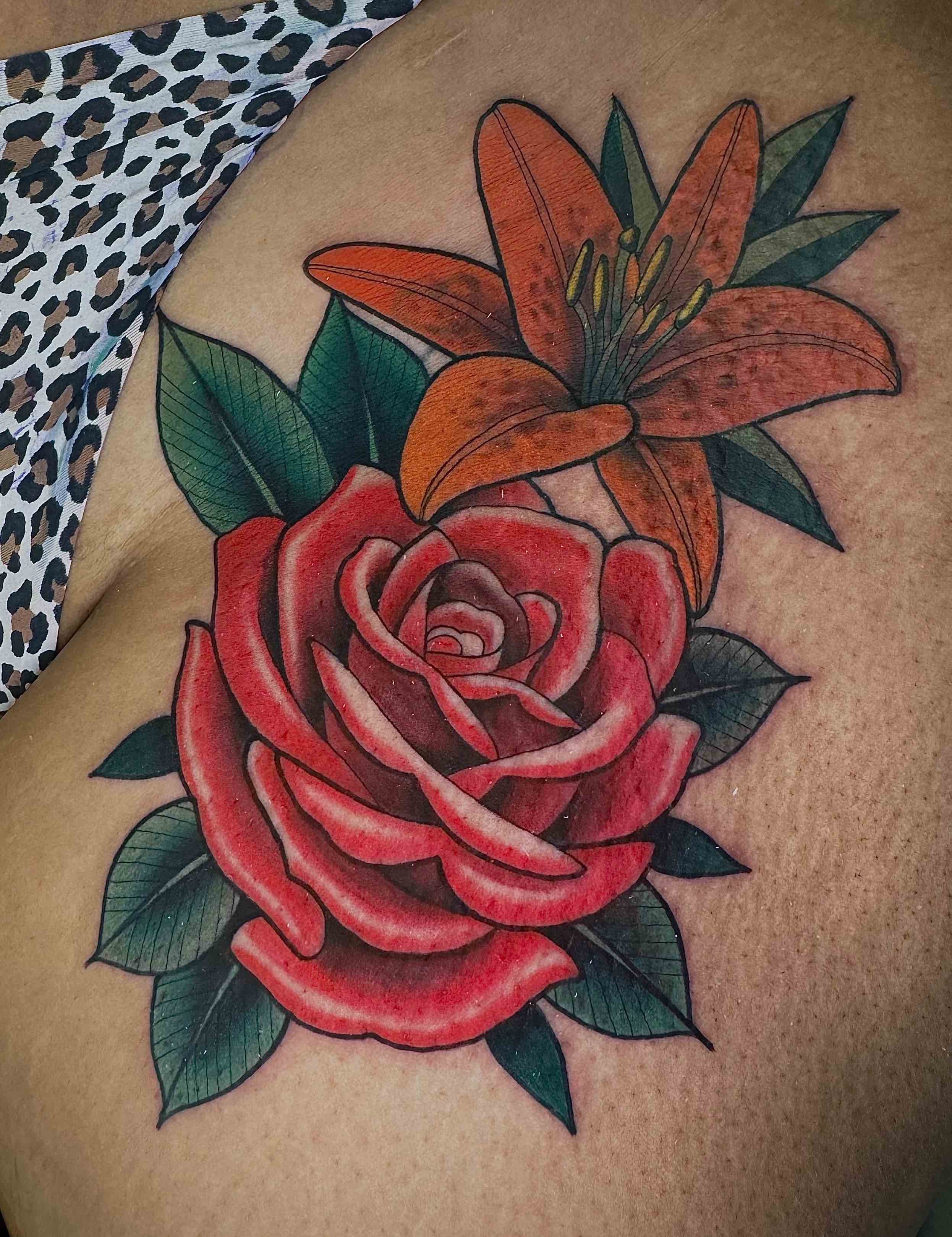 Neo traditional rose and lily flowers tattoo in color portfolio work by Keith Kuzara at Sink or Swim Tattoo and Piercing in Niagara Falls NY
