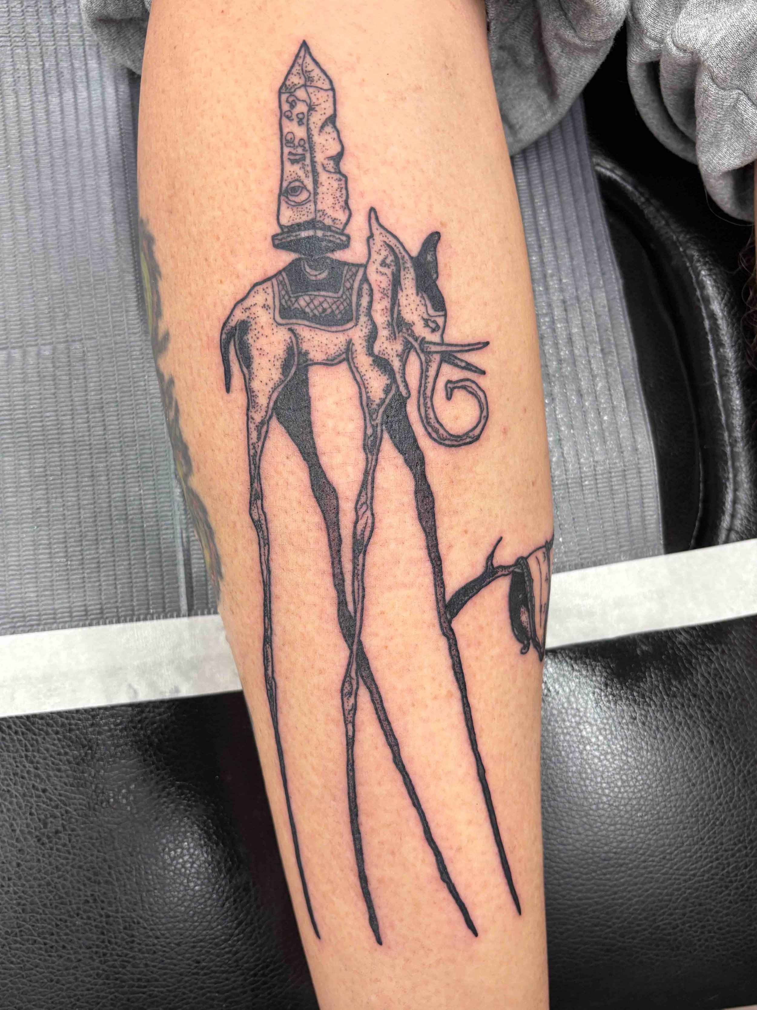 dot work tattoo of an elephant in Salvador Dali style, portfolio work by Samantha Sullivan at Sink or Swim Tattoo and Piercing in Niagara Falls, NY